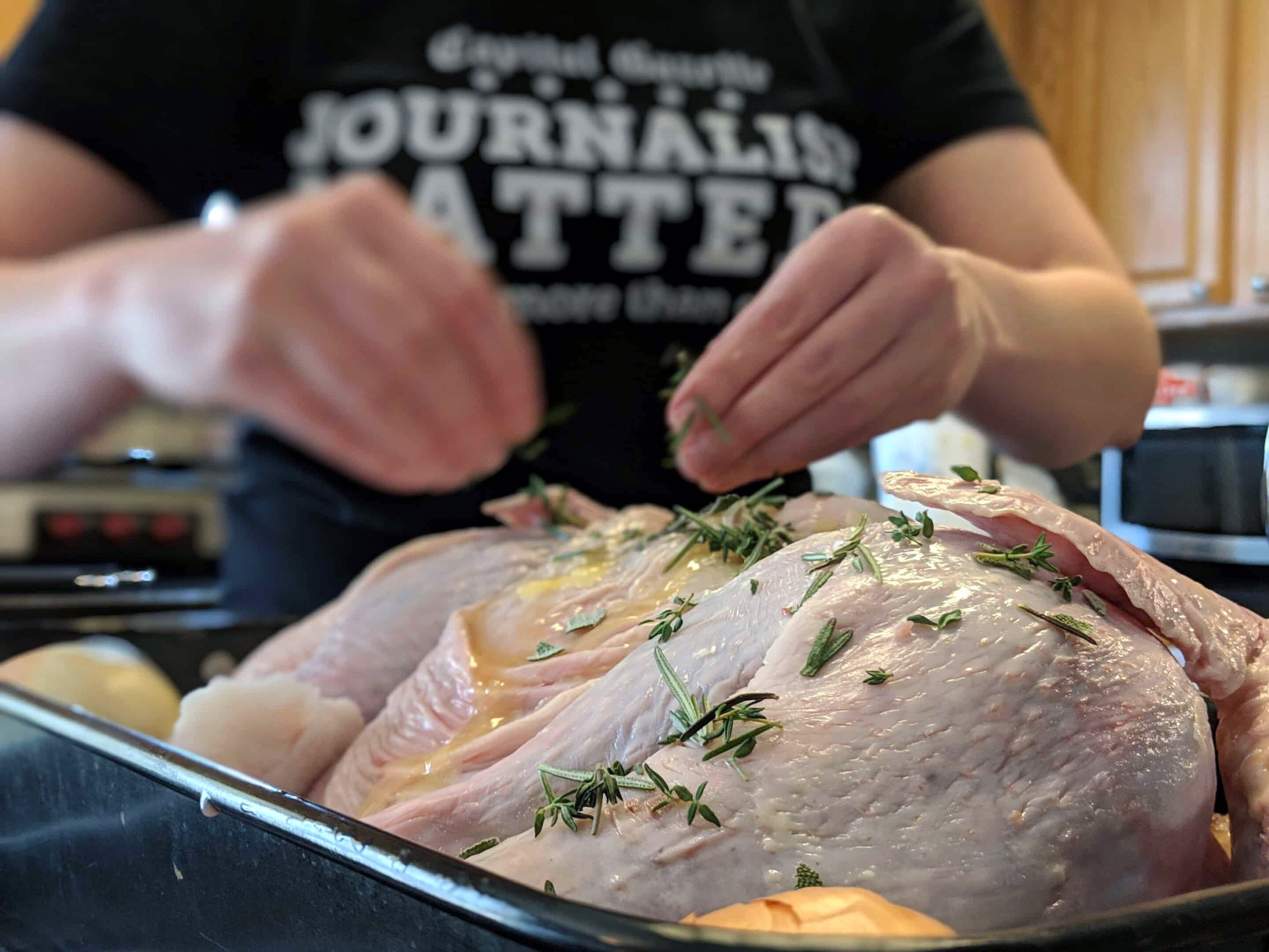 Spatchcocking a turkey, by removing its backbone and pressing it flat, allows it to cook much faster in the oven.
