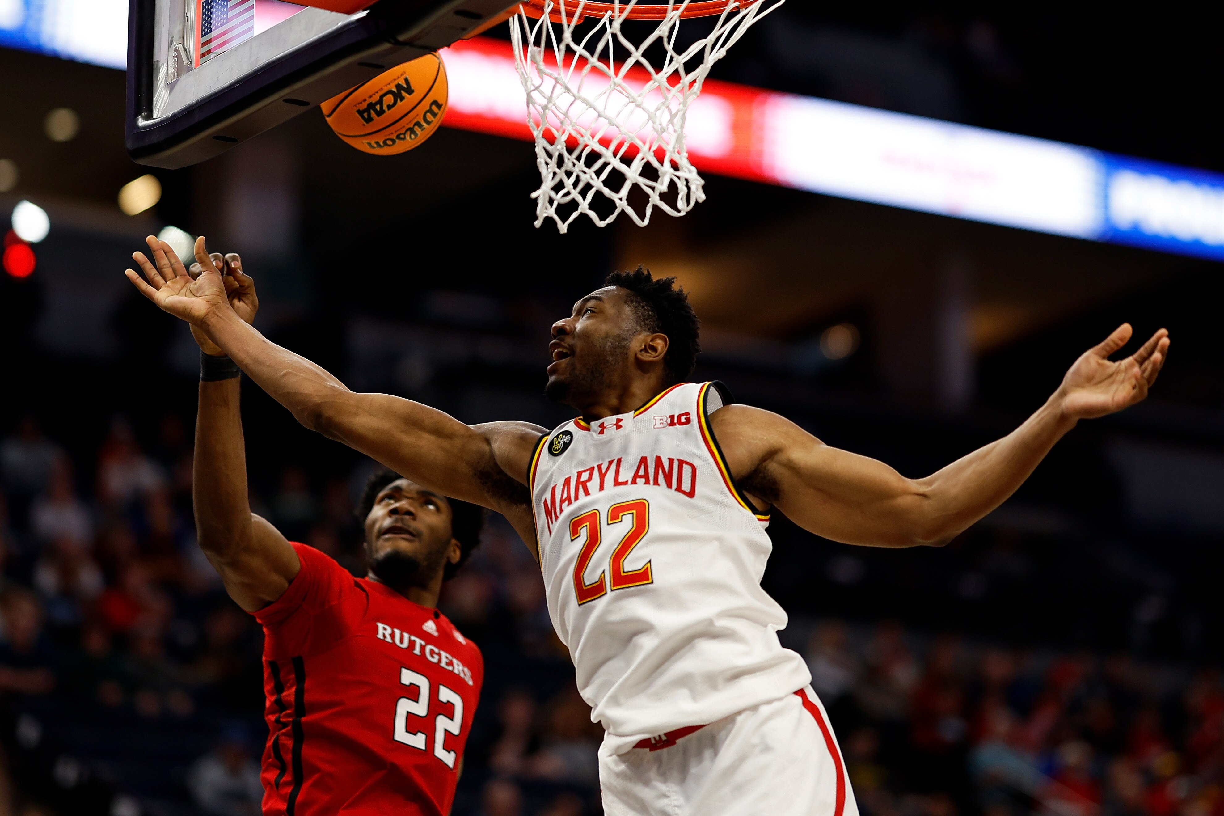 Emmanuel Ogbole of Rutgers blocks a shot by Jordan Geronimo of Maryland during the first half of the game Wednesday night in the Big Ten tournament.