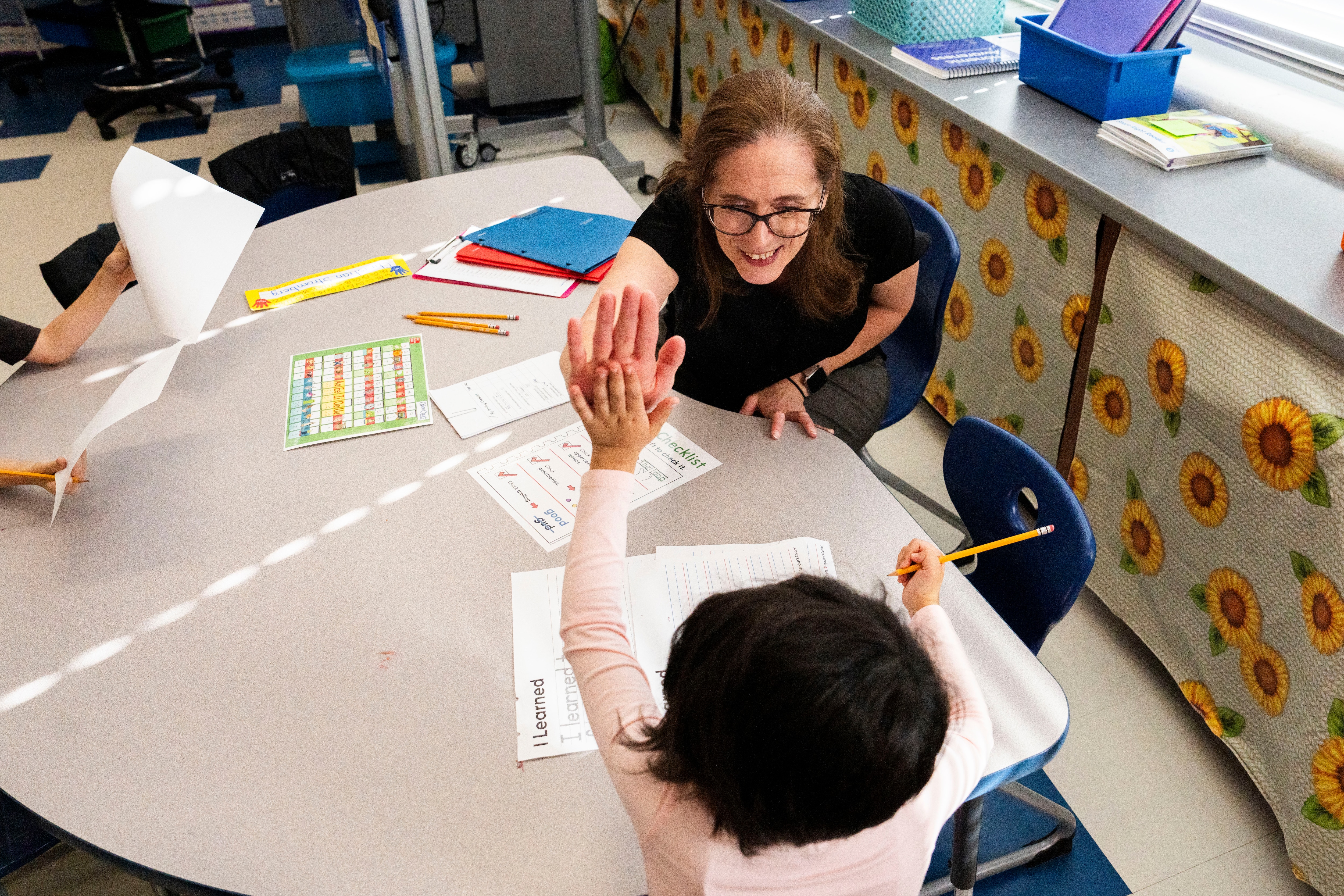 Teacher Lacey George interacts with kindergarten students in the classroom at Westowne Elementary in Catonsville on November 11, 2024.
