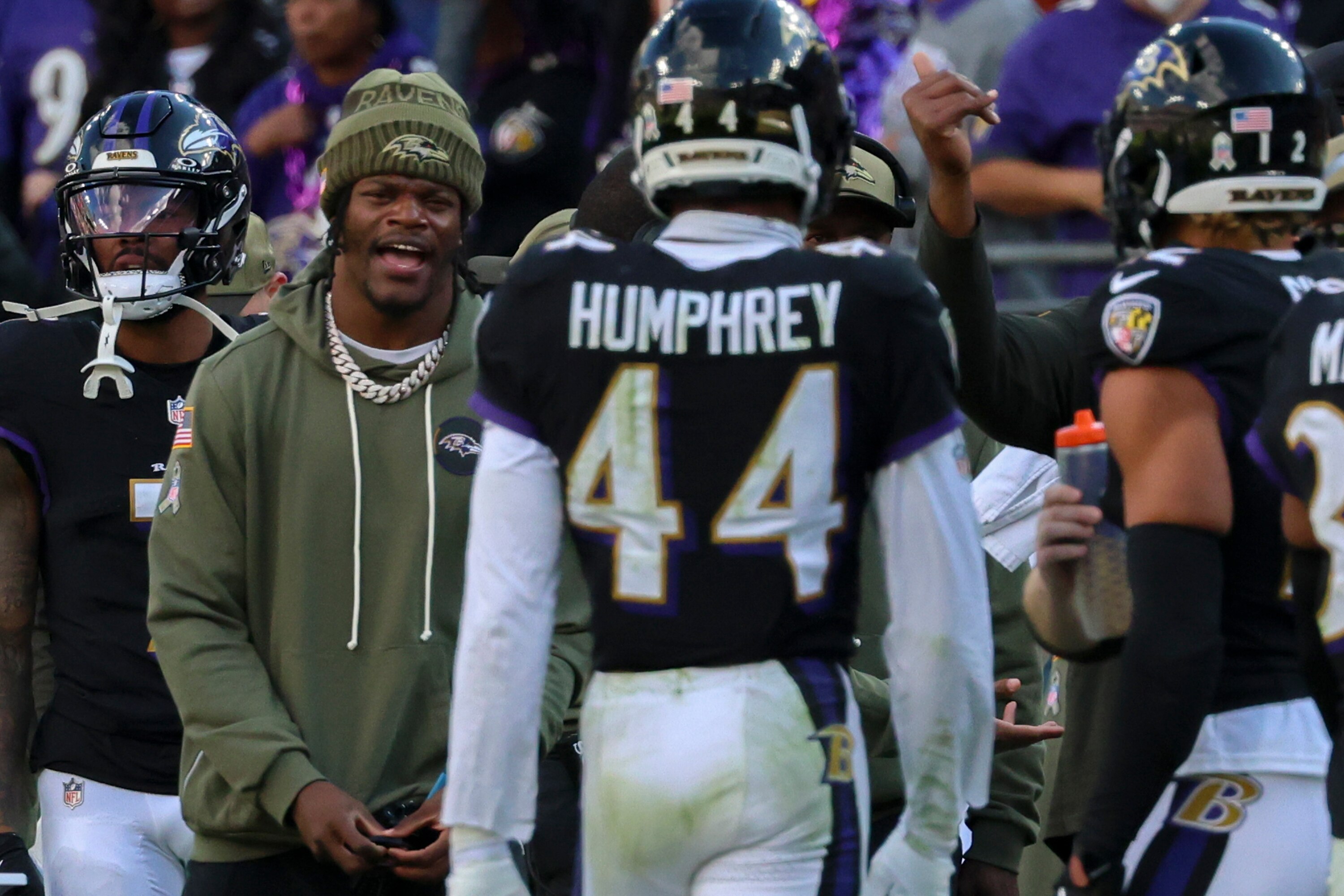 Ravens quarterback Lamar Jackson cheers from the sidelines during the Ravens’ win over the Chicago Bears.