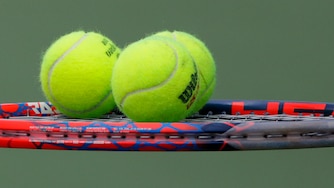 Tennis balls sit on the racket of Diego Schwartzman, of Argentina, during a match against Jaume Munar, of Spain, during the second round of the U.S. Open tennis tournament, Thursday, Aug. 30, 2018, in New York.