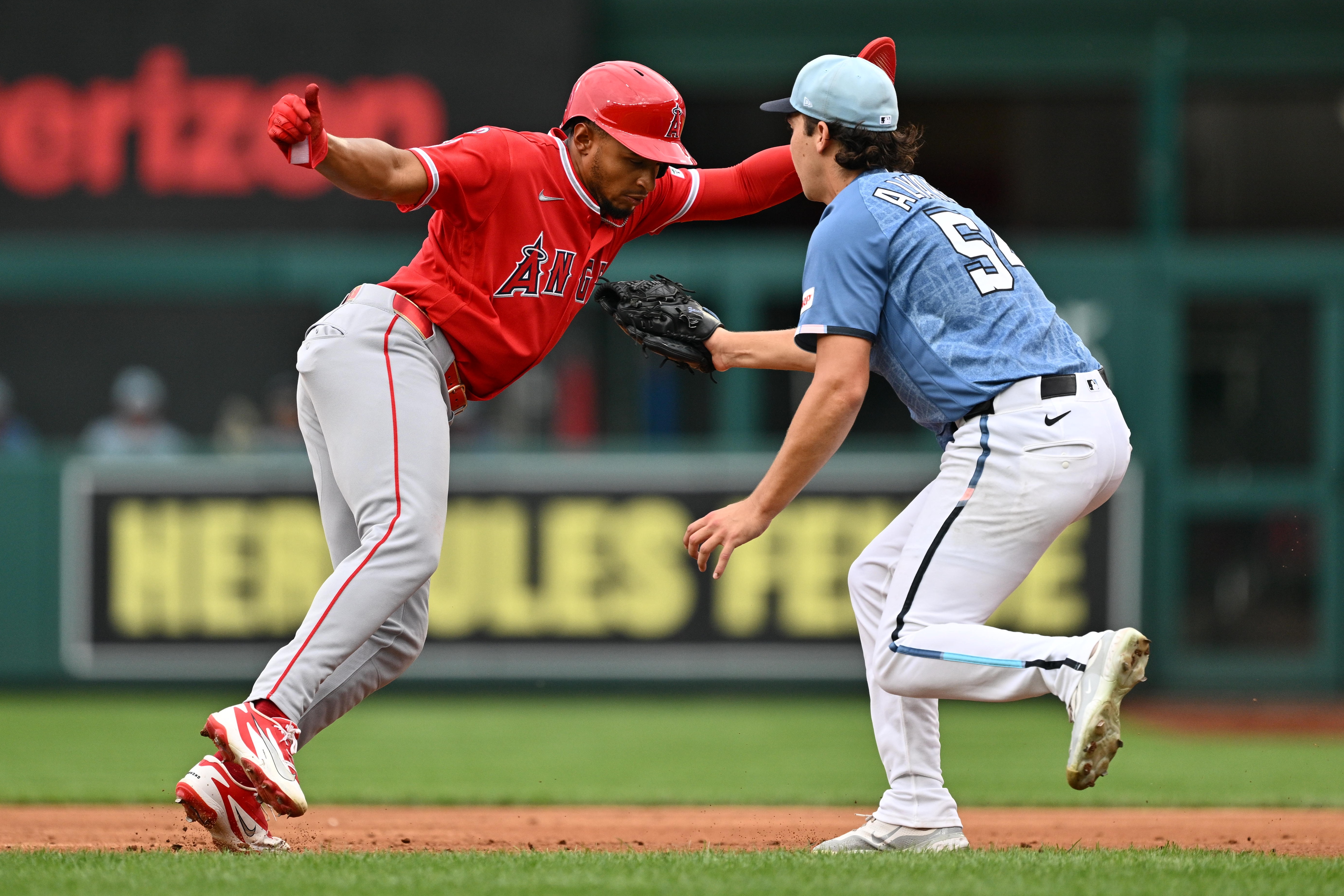 Nationals pitcher Andrew Alvarez tags out Christian Moore of the Angels after a second-inning rundown.