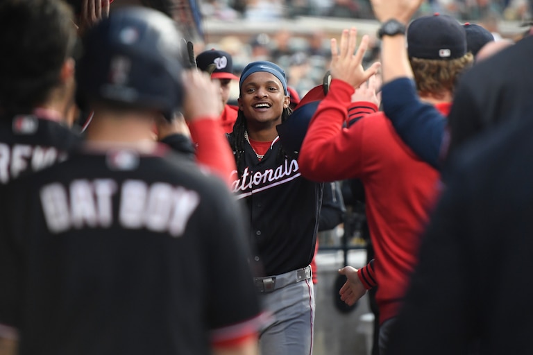 Washington Nationals' CJ Abrams, middle, is congratulated after hitting a home run during the second inning against the Detroit Tigers.