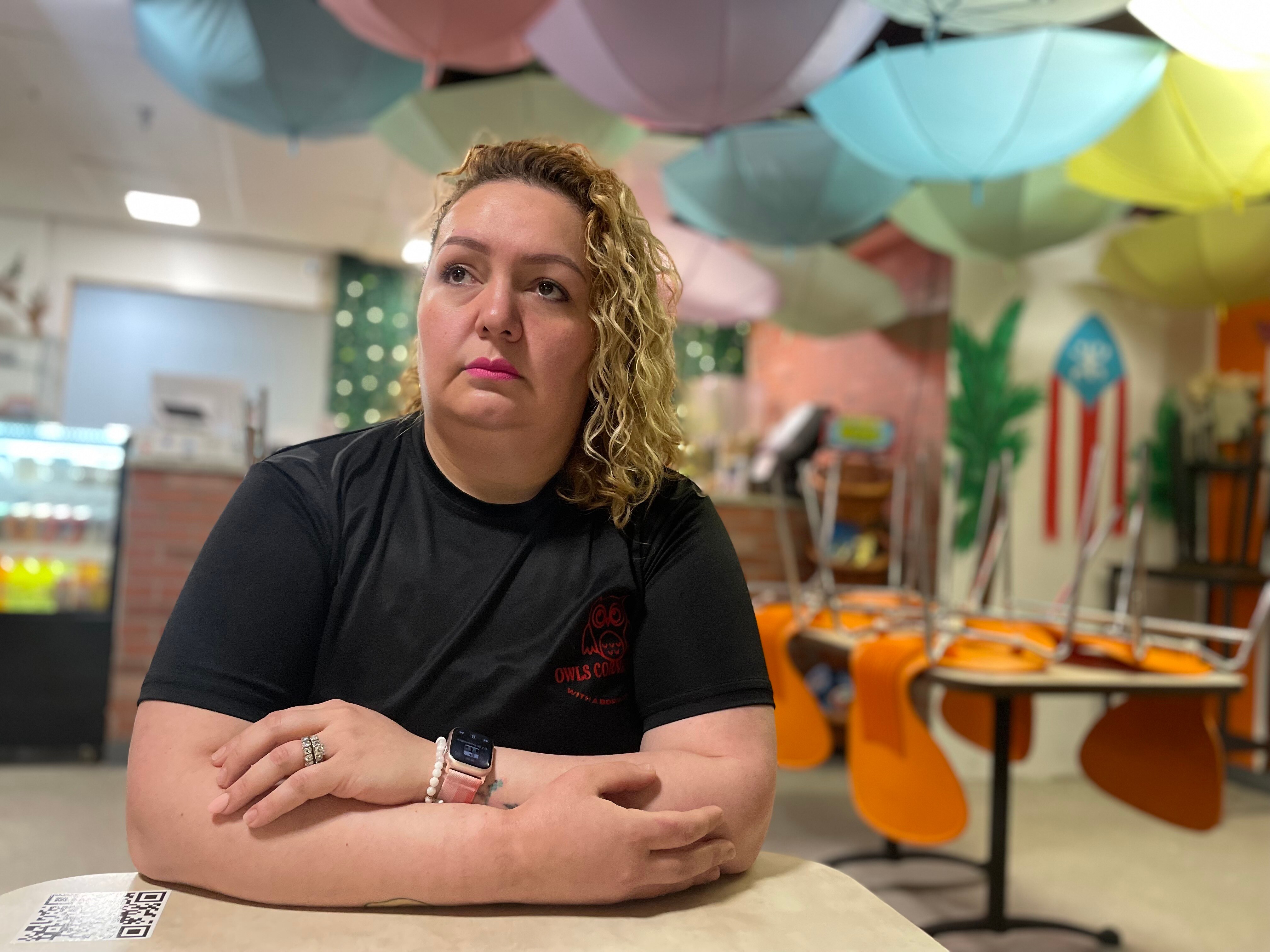 Lilly Ordoñez sits in Owls Corner Cafe, the Dundalk restaurant she opened in 2021. The husband of one of her employees was working on the bridge when it fell.