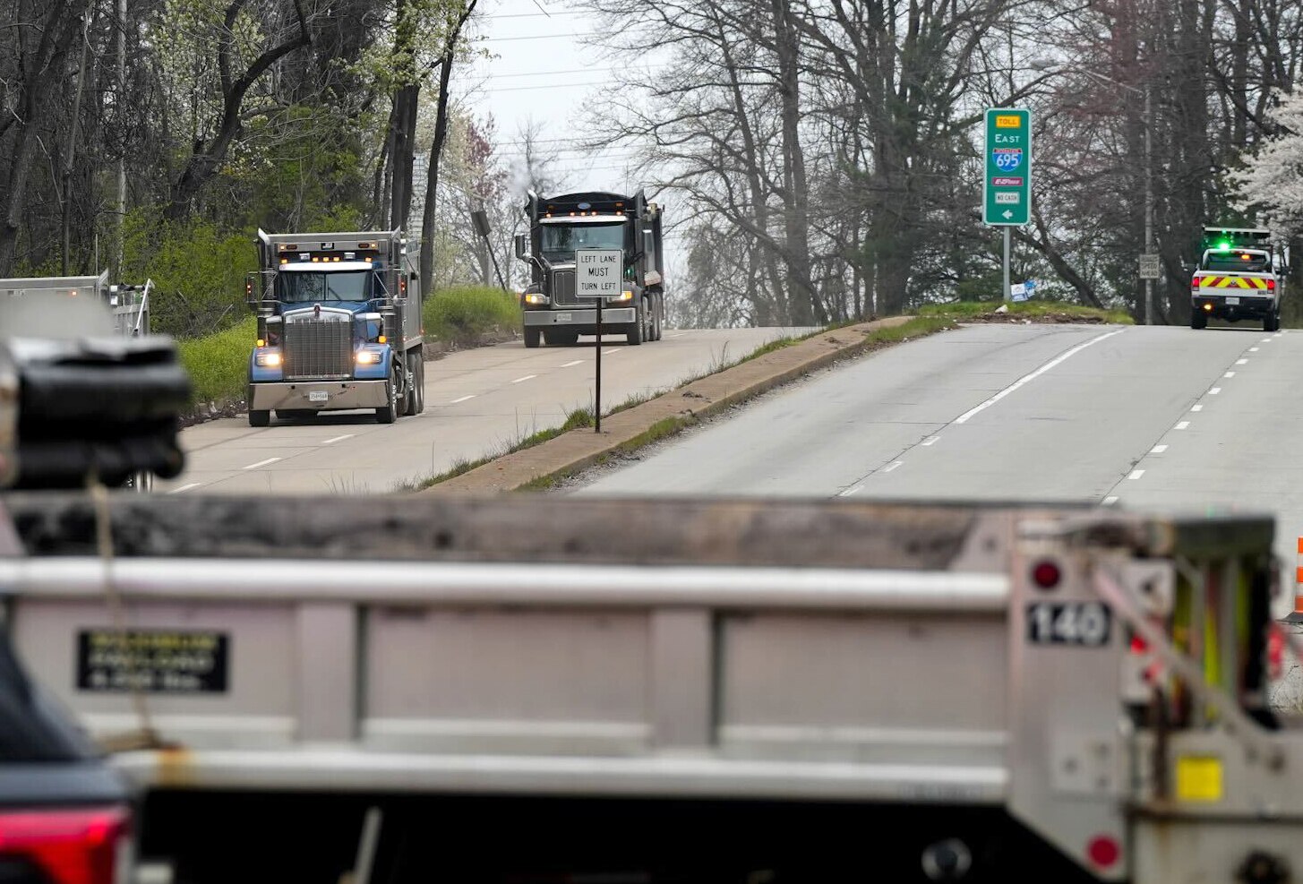 Trucks coming back from the way of the Francis Scott Key Bridge, which was toppled by a massive container ship on March 26, 2024. The loss of the bridge, a key segment in the Baltimore Beltway, has left drivers looking for other routes around the city or to and from the Port of Baltimore.