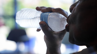 Ben Jones sips a bottle of water inside the Zeta Center for Healthy and Active Aging, one of the Baltimore City Health Department’s cooling centers, in northwest Baltimore, Md. on Monday, June 23, 2025.