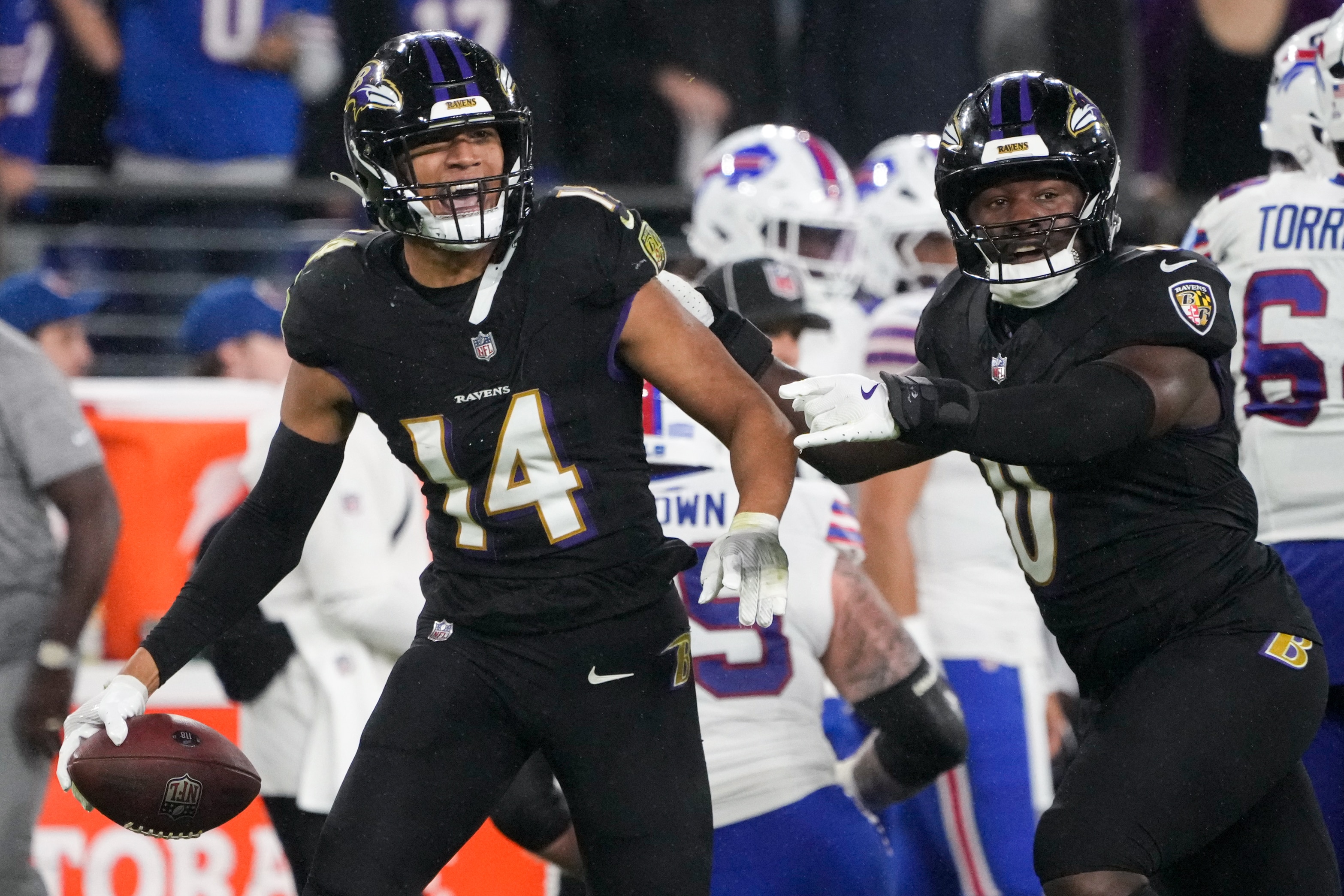 Baltimore Ravens safety Kyle Hamilton (14) celebrates after recovering a fumble in a game against the Buffalo Bills at M&T Bank Stadium in Baltimore on Sunday, September 29, 2024.