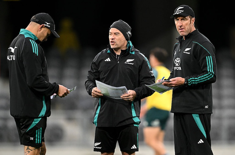 Assistant coach Scott Hansen and performance coach Nic Gill look on during a New Zealand All Blacks training session on July 3, 2025.