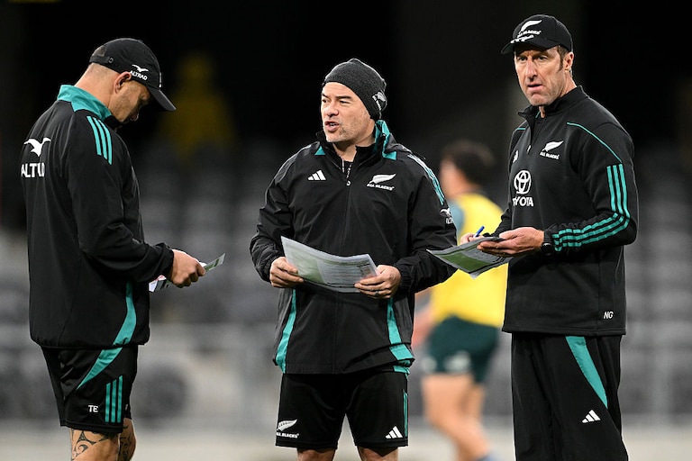 Assistant coach Scott Hansen and performance coach Nic Gill look on during a New Zealand All Blacks training session on July 3, 2025.
