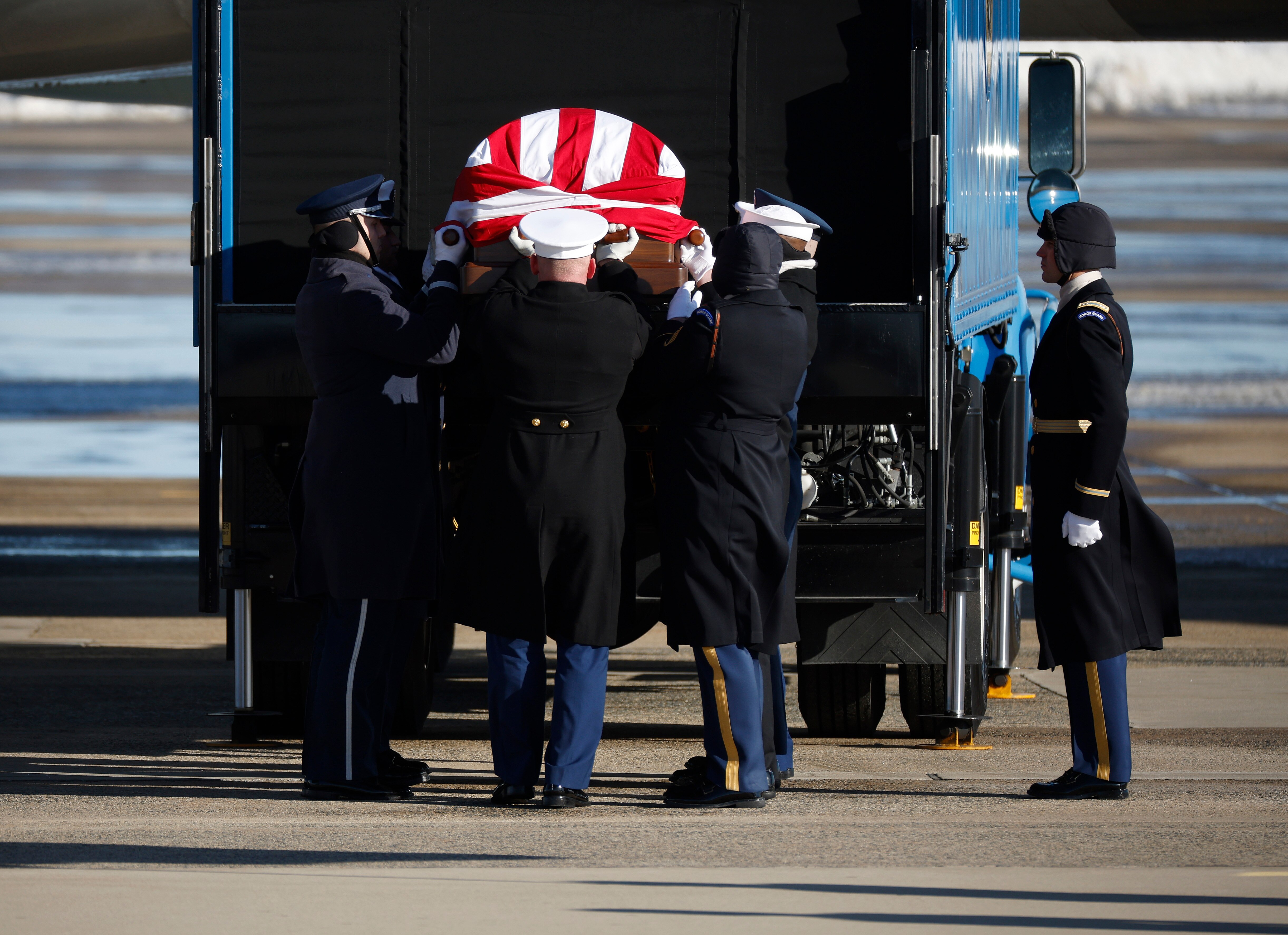 JOINT BASE ANDREWS, MARYLAND - JANUARY 07: A military honor cordon transfers the flag-draped casket of former U.S. President Jimmy Carter to a hearse during an arrival ceremony on January 07, 2025 in Joint Base Andrews, Maryland. Carter’s body will lie in state in the Capitol Rotunda until a funeral service at the National Cathedral in Washington on January 9. Carter, the 39th President of the United States, died at the age of 100 on December 29, 2024 at his home in Plains, Georgia.