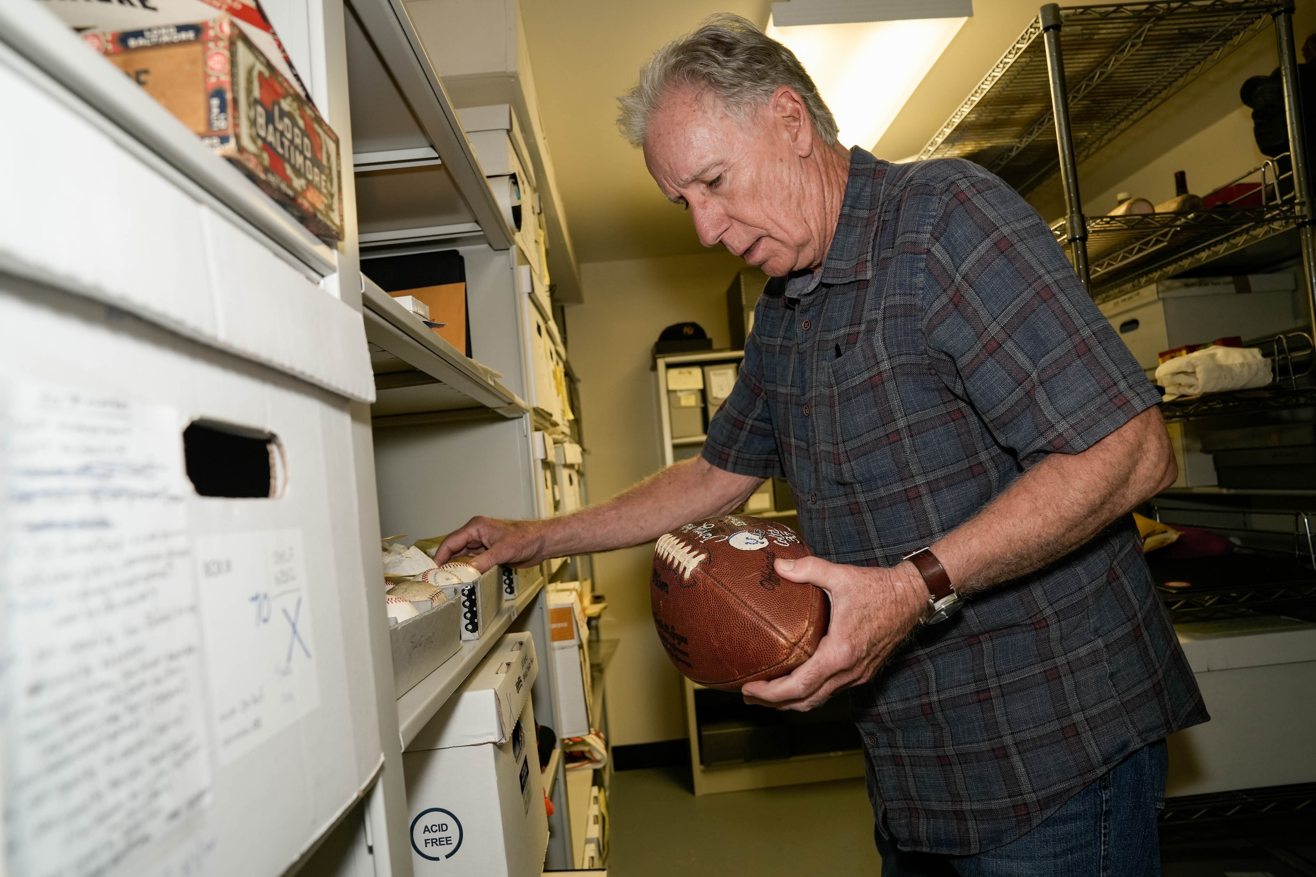 Sports memorabilia and historical artifacts sit in the basement of the Babe Ruth Birthplace and Museum on June 21, 2023. Since 1982, Michael Gibbons has worked on the collection and curation of thousands of pieces of Maryland sports history, most of which now sit on the bottom floor of the Babe Ruth Birthplace and Museum, where Gibbons serves as the director emeritus and historian.