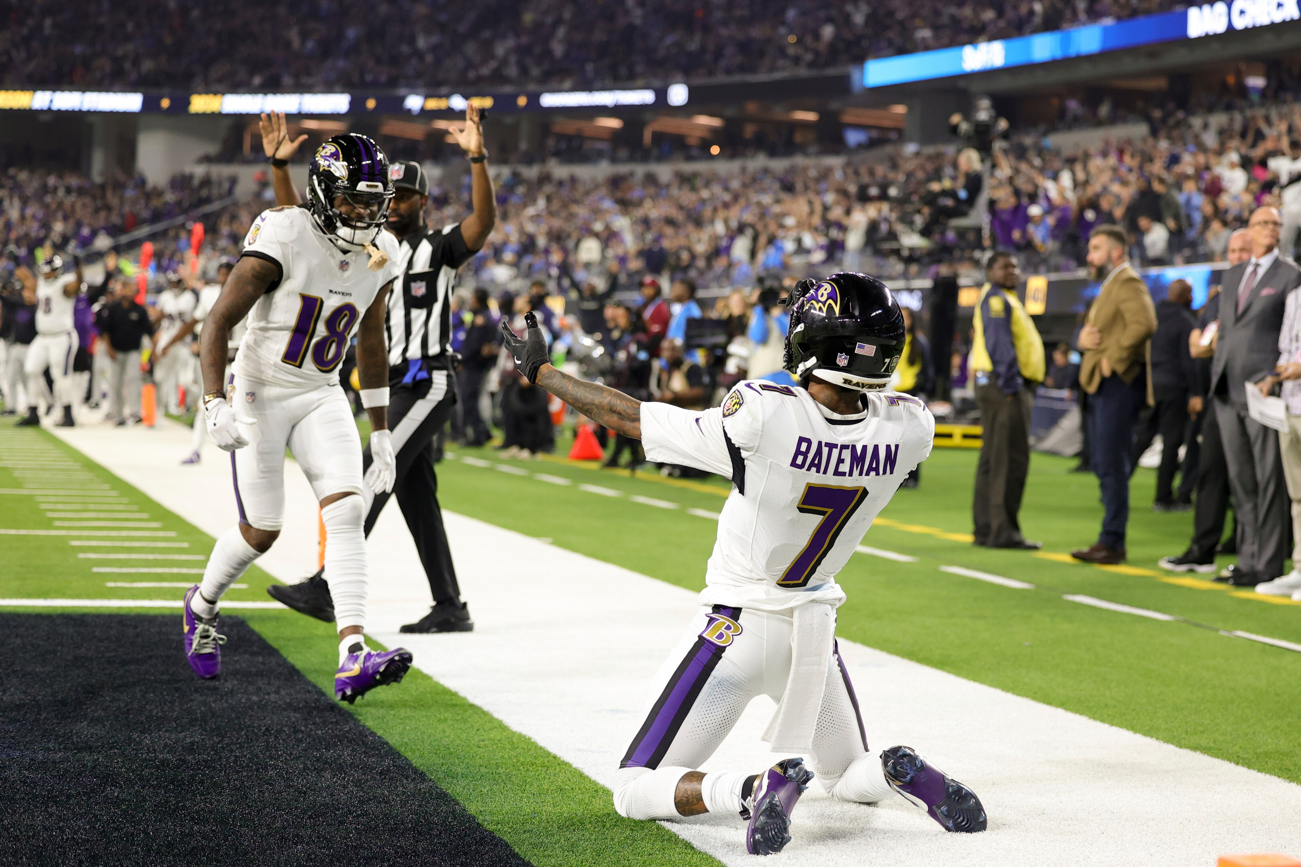 Ravens wide receiver Rashod Bateman celebrates his touchdown catch late in the first half with wide receiver Diontae Johnson.