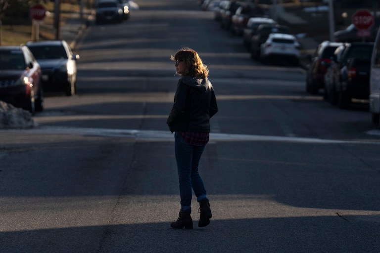 Lisa Austin walks through the Brooklyn neighborhood in Baltimore, on Friday, February 13, 2026. Austin is psychologist at Maree G. Farring Elementary/Middle school.