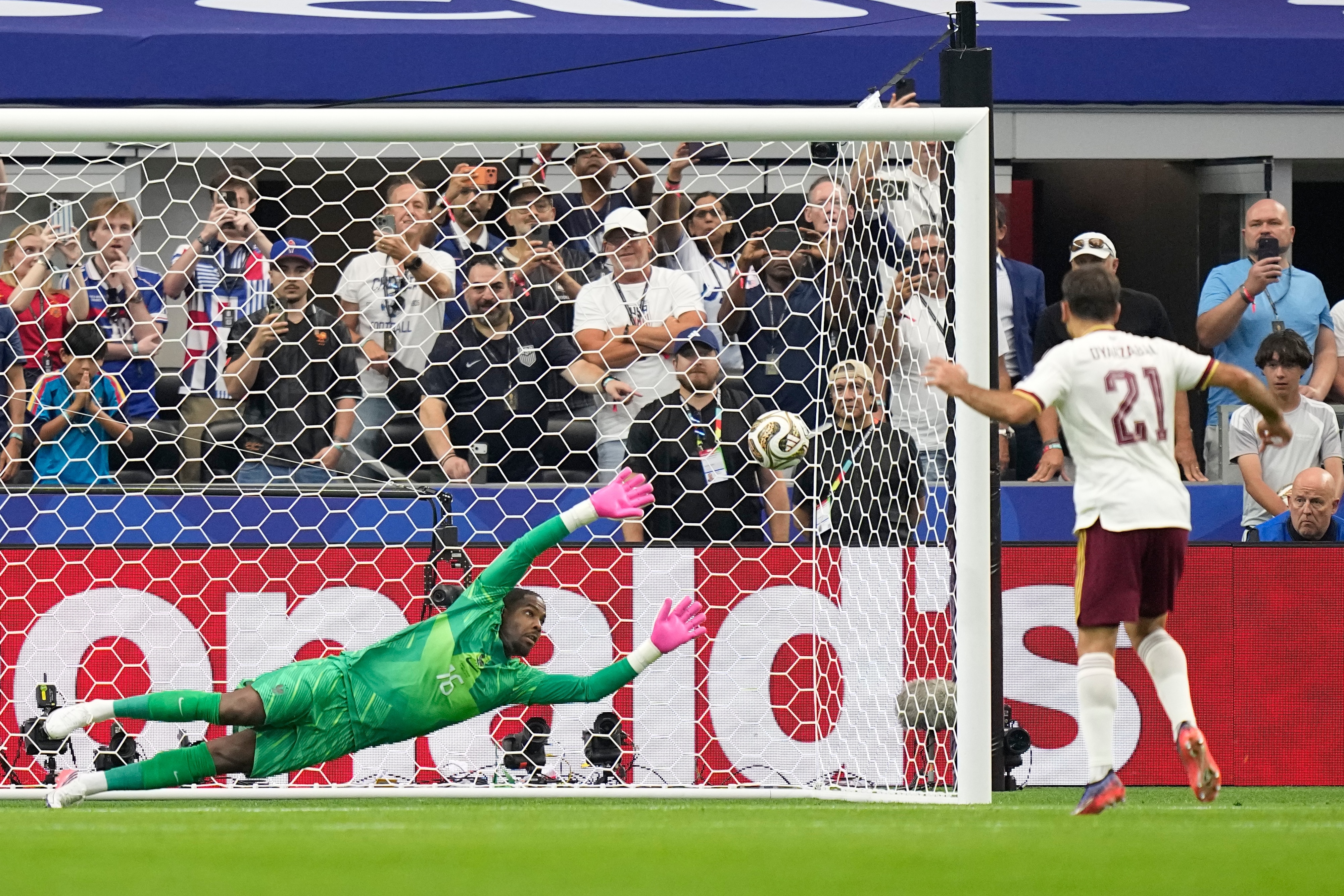 Spain's Mikel Oyarzabal scores the opening goal from the penalty spot past France goalkeeper Mike Maignan during the World Cup semifinal soccer match.