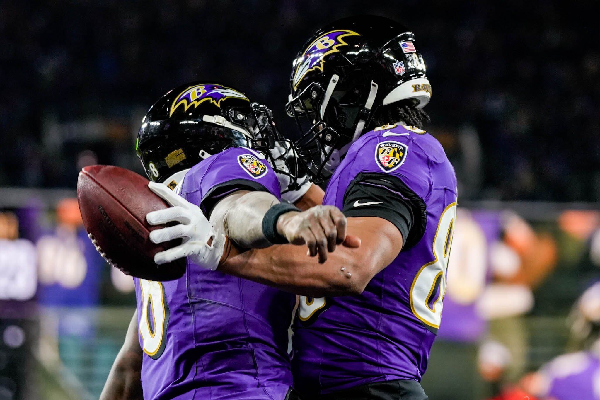 Ravens tight end Isaiah Likely (right) and quarterback Lamar Jackson celebrate their connection on a fourth-quarter touchdown pass.