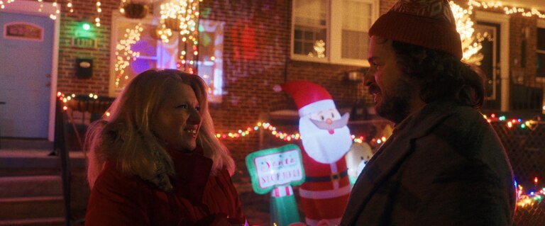 Liz Larsen and Michael Strassner in a scene at Hampden’s Miracle on 34th Street.