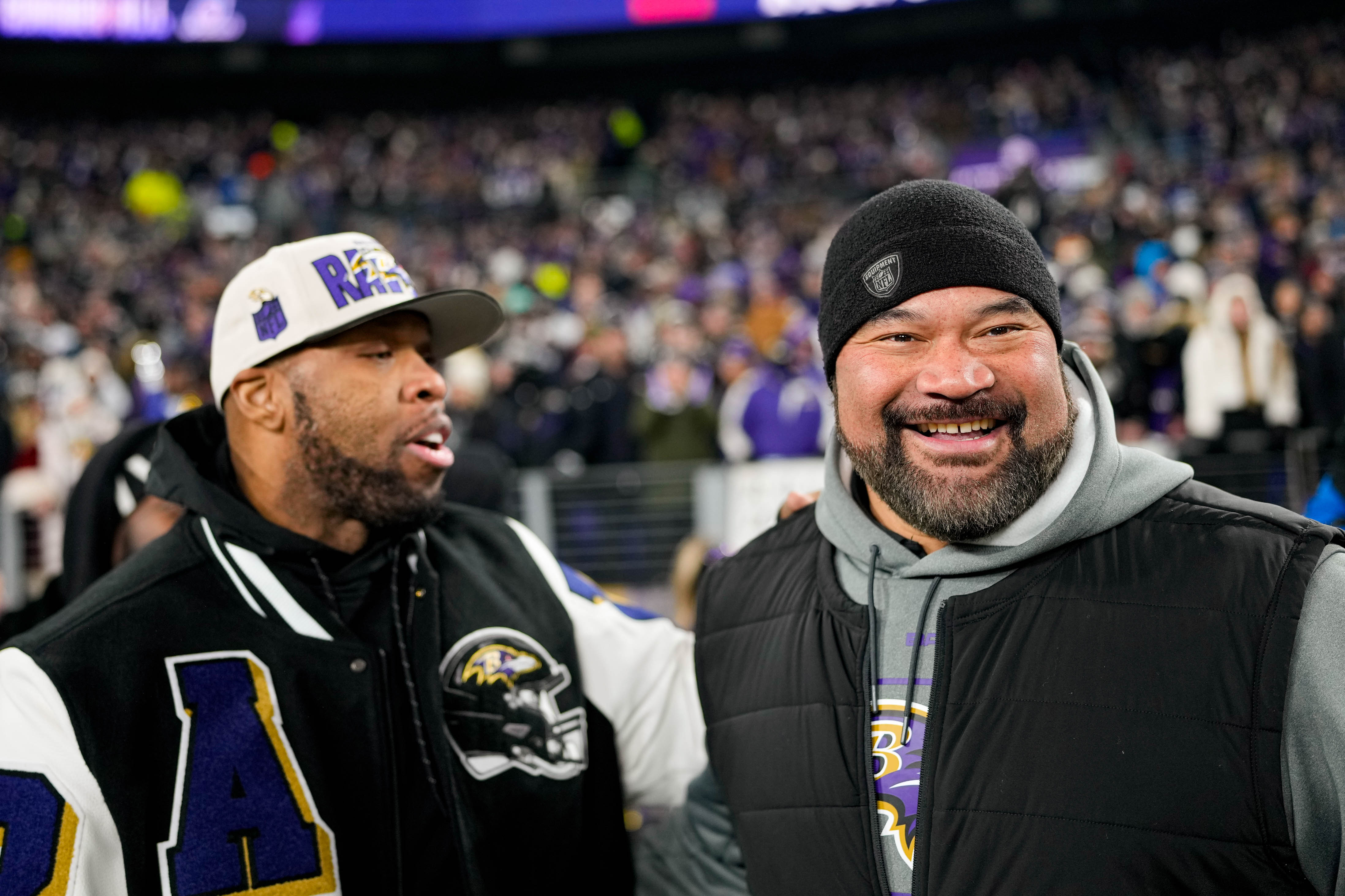 Baltimore Ravens legends Haloti Ngata, right, and Terrell Suggs hang out on the sidelines ahead of the AFC wild card playoff game against the Pittsburgh Steelers at M&T Bank Stadium on Saturday, January 11, 2025.