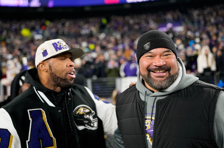 Baltimore Ravens legends Haloti Ngata, right, and Terrell Suggs hang out on the sidelines ahead of the AFC wild card playoff game against the Pittsburgh Steelers at M&T Bank Stadium on Saturday, January 11, 2025.