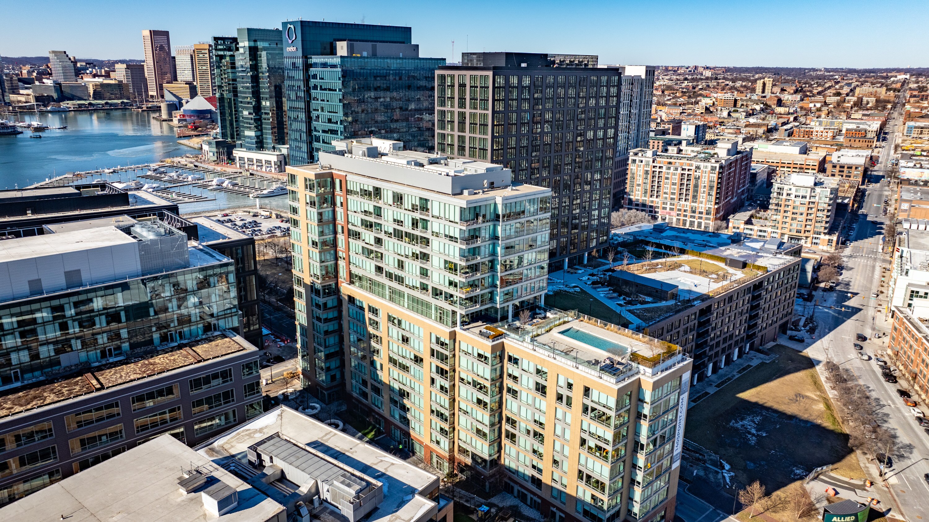 Luxury apartment buildings, such as a high-rise in Harbor Point, have faced challenges in finding renters.