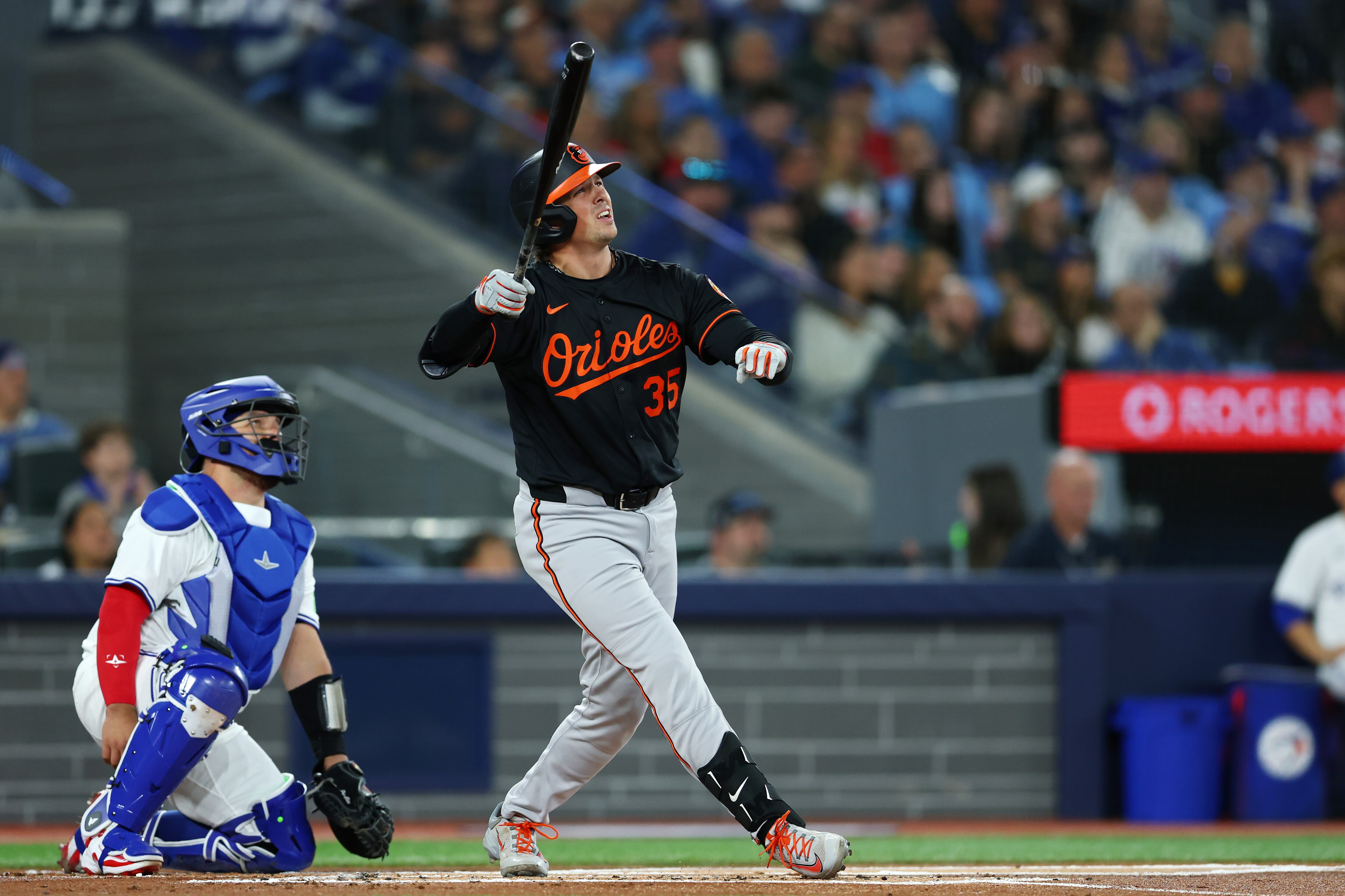 Adley Rutschman watches the first of his two home runs against the Toronto Blue Jays on opening day.
