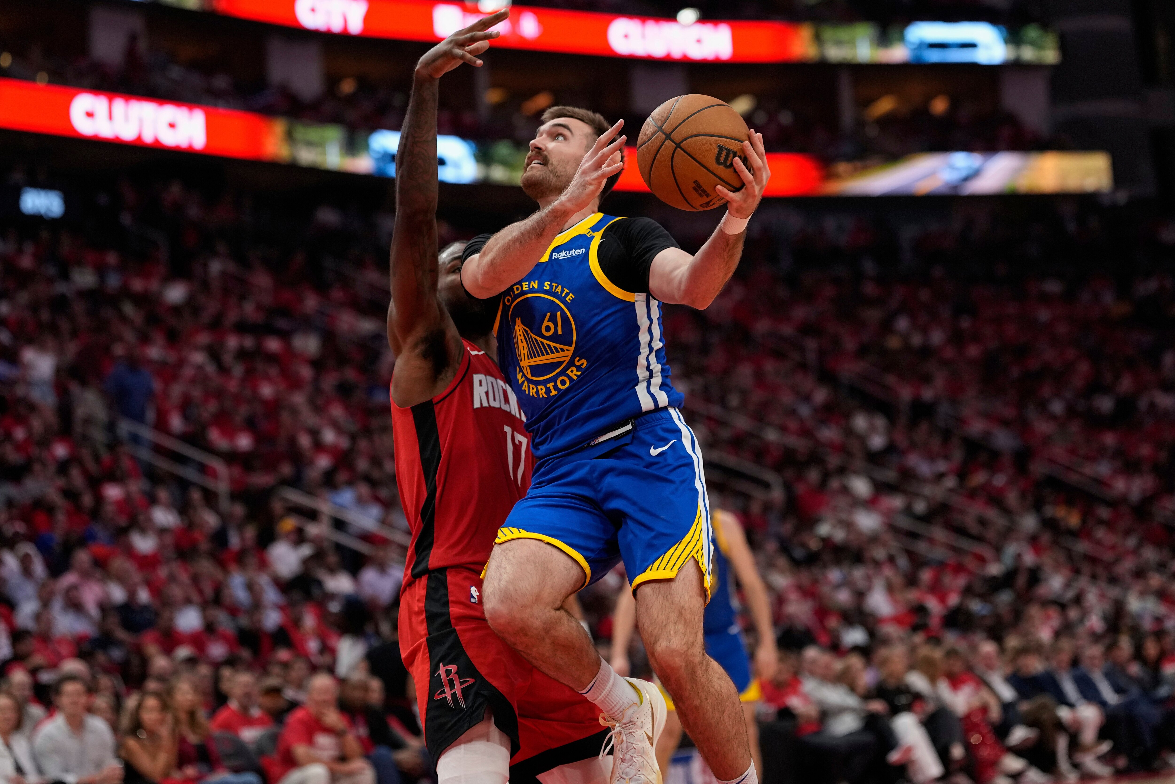 Golden State Warriors guard Pat Spencer (61) drives past Houston Rockets forward Tari Eason (17) during the second half of Game 5 of an NBA basketball first-round playoff series.