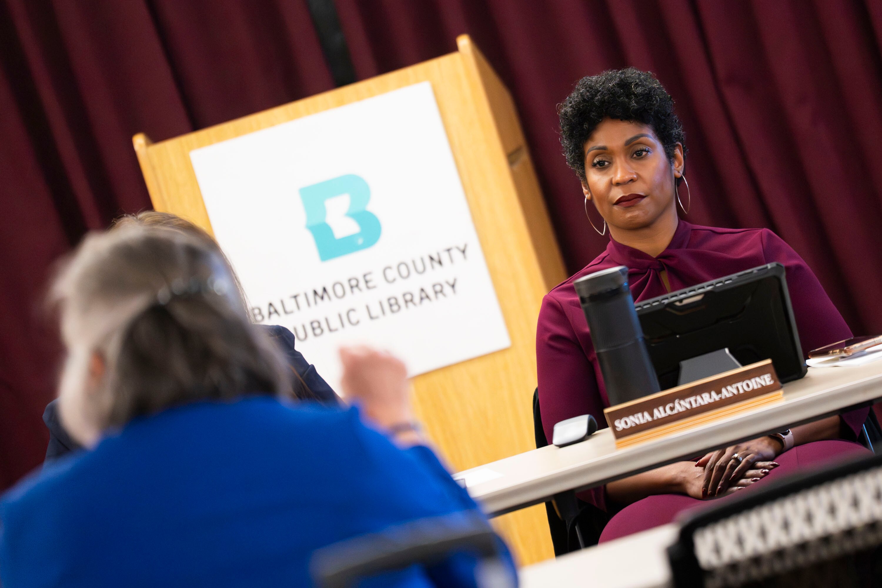 Baltimore County Public Library’s Towson branch CEO Sonia Alcántara-Antoine listens and responds to a handful of concerned librarians and community members as they air their grievances after the sudden firing of fourteen part-time library employees during an emergency meeting on November 18, 2025 at the Towson Library.