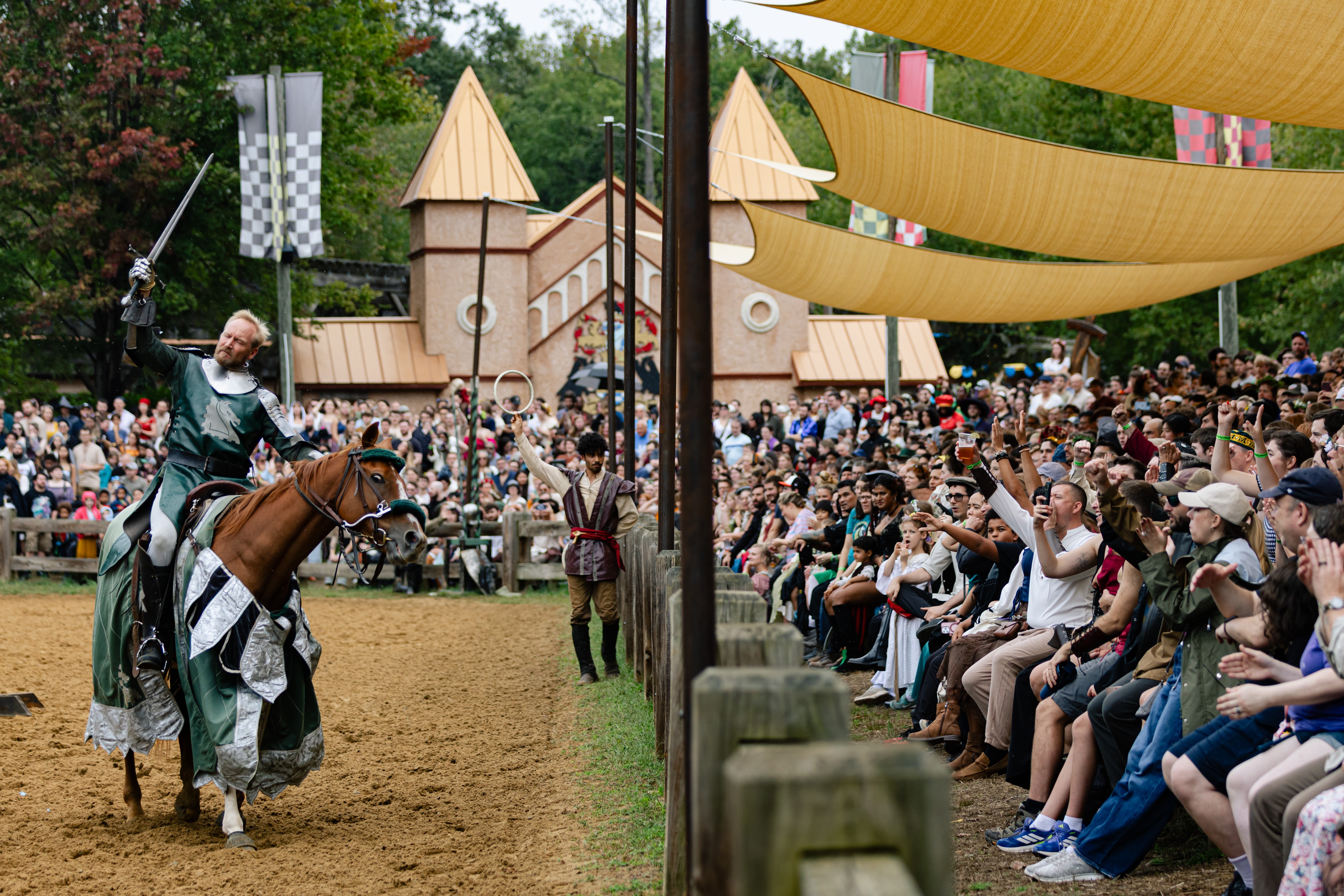 Sir William DeBracey performs for the crowd before jousting at the Maryland Renaissance Festival grounds in Crownsville in 2025. 