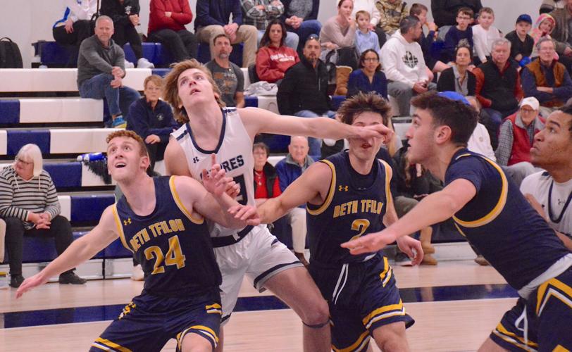 Beth Tfiloh's Stanley Dansicker (24) boxes out Saints Peter & Paul's Aaron Ewing during a MIAA C Conference basketball match during the regular season. The top-seeded Warriors and No. 2 seed Sabers will meet for the league championship Sunday at UMBC.