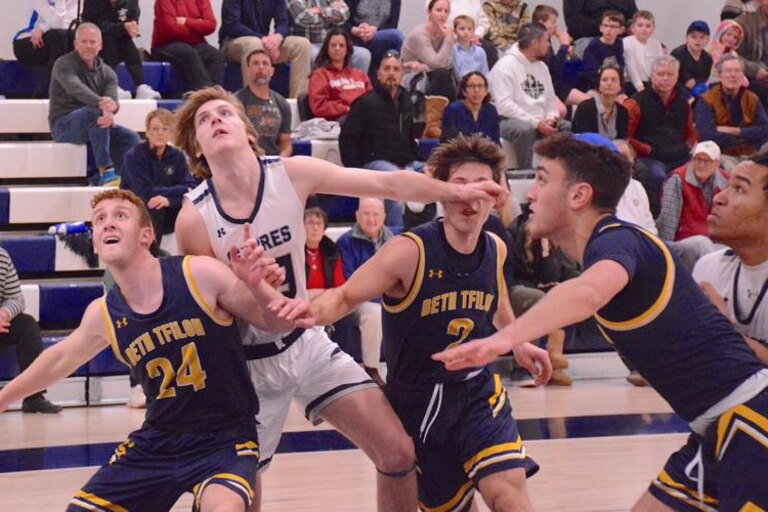Beth Tfiloh's Stanley Dansicker (24) boxes out Saints Peter & Paul's Aaron Ewing during a MIAA C Conference basketball match during the regular season. The top-seeded Warriors and No. 2 seed Sabers will meet for the league championship Sunday at UMBC.