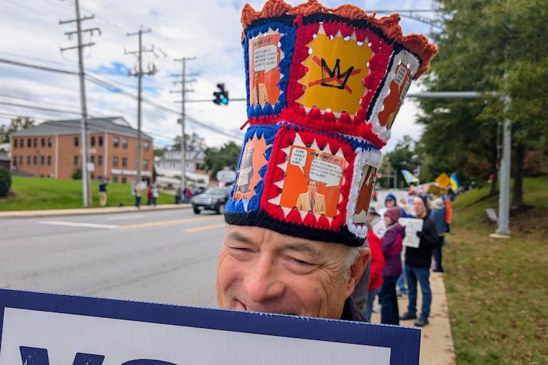 Pete Doyle of Annapolis makes themed hats, like this one with the host of an old television game show. About 600 people walked along Generals Highway and Bestgate Road on Oct. 17, 2026.