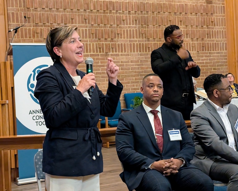 Allison Pickard answers a question at the ACT forum at Asbury United Methodist Church in Annapolis, as fellow Democratic county executive candidates Pete Smith and Kyle Nembhard listen.