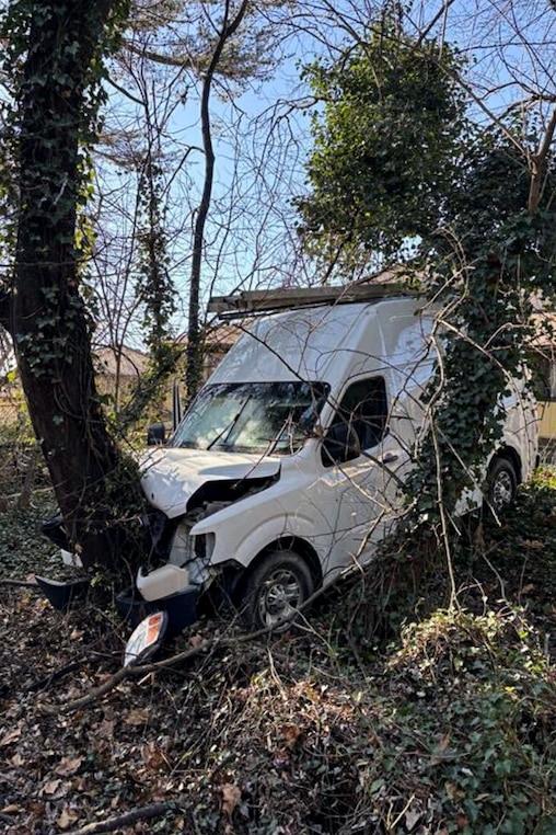 The Department of Homeland Security posted photos to X of a white van that crashed into a nearby tree after ICE agents shot the driver.