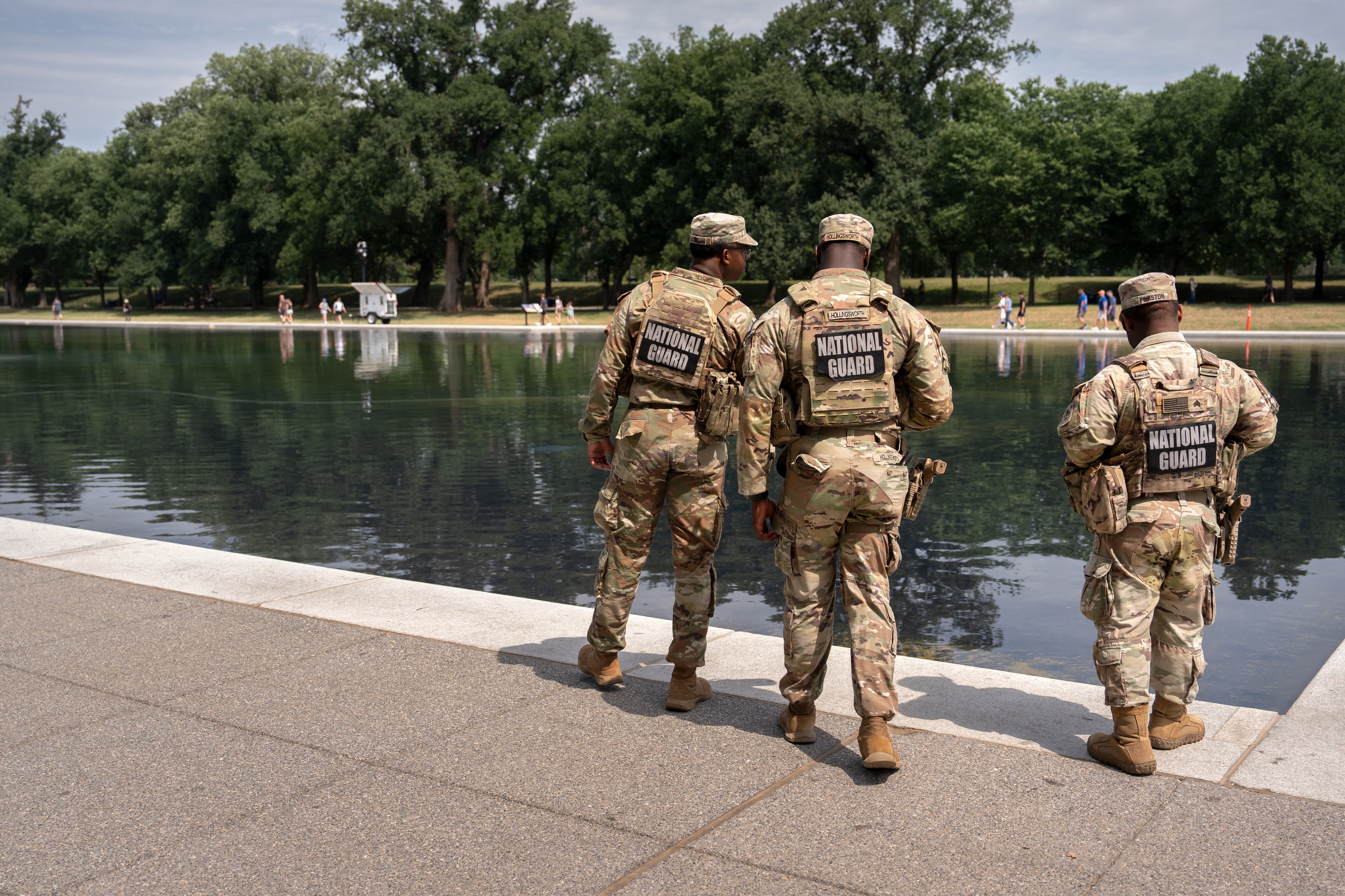 National Guard members look at the Lincoln Memorial Reflecting Pool, Monday, June 22, 2026, in Washington.