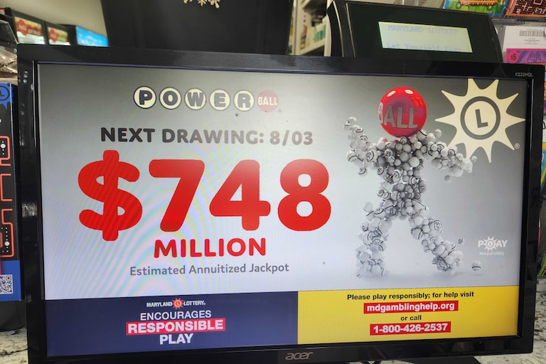 A lottery screen at Triple Fam Mart in Mount Vernon shows the next Powerball jackpot at $748 million. The next drawing is Monday, Aug. 3, 2026.