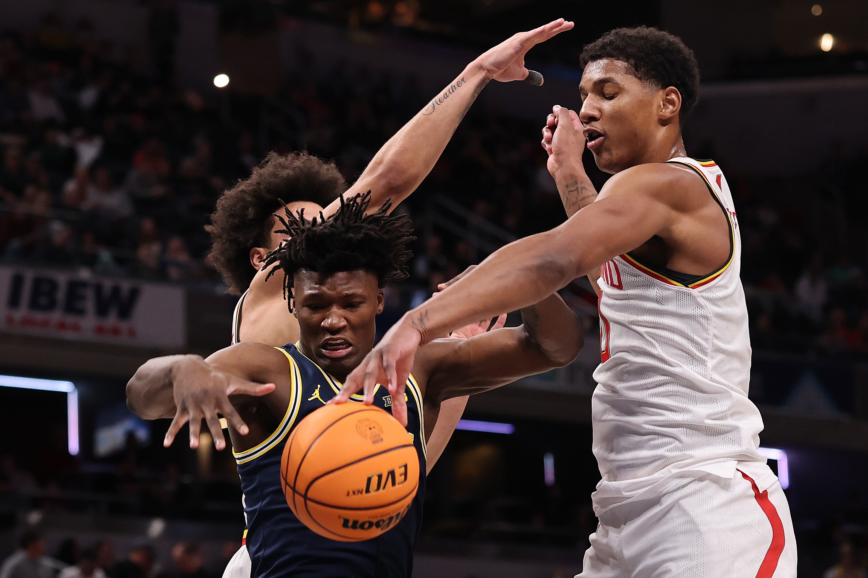 Maryland’s Julian Reese, right, battles L.J. Cason of Michigan for the ball during the Big Ten tournament semifinals Saturday.