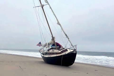 A large abandoned sailboat washed ashore a Delaware Beach recently and the mystery behind it ultimately led to an arrest in a 2021 arson case in Maryland.