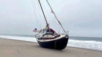 A large abandoned sailboat washed ashore a Delaware Beach recently and the mystery behind it ultimately led to an arrest in a 2021 arson case in Maryland.