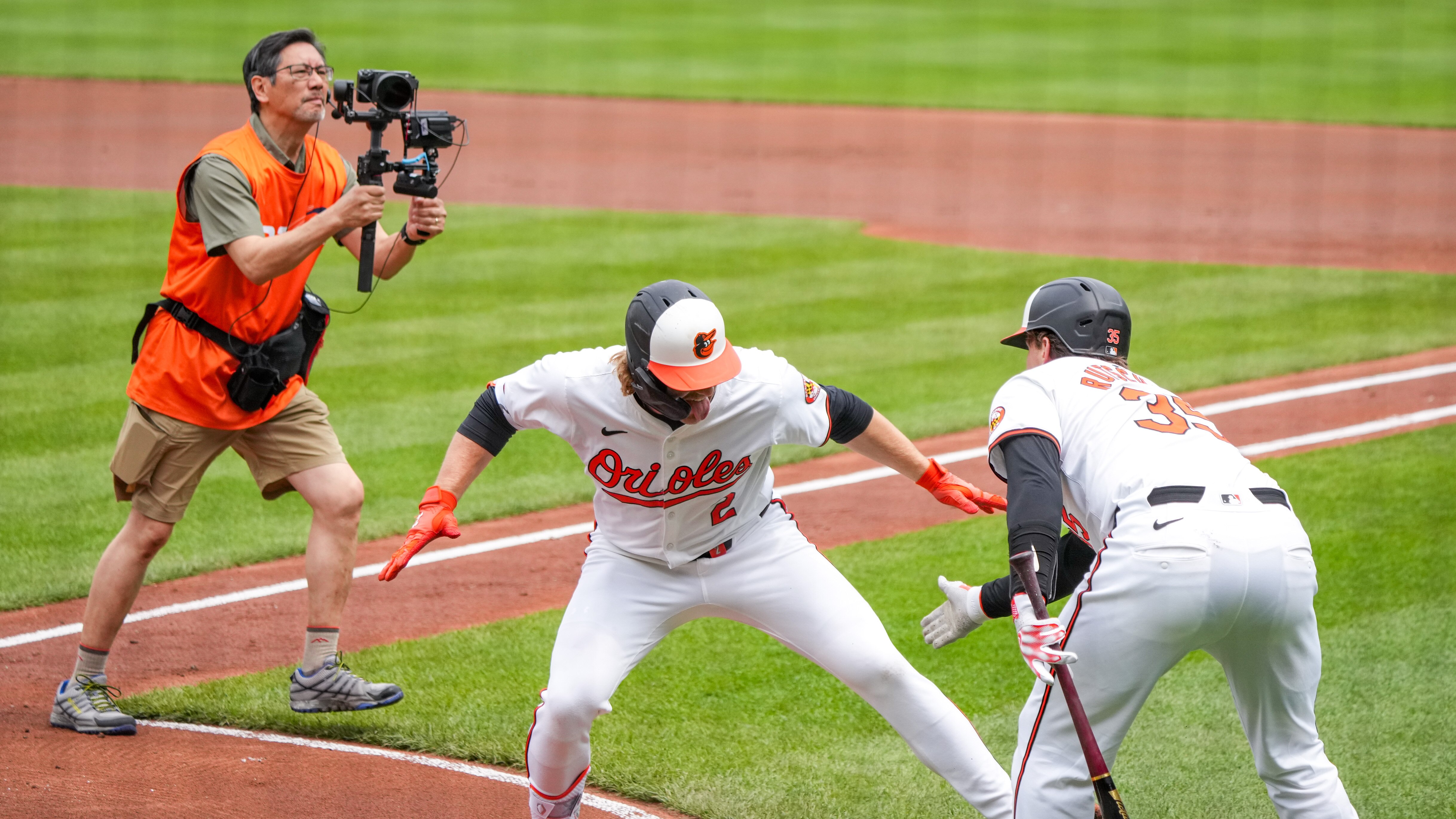 Orioles shortstop Gunnar Henderson (left) and catcher Adley Rutschman are leading the All-Star voting at their positions.