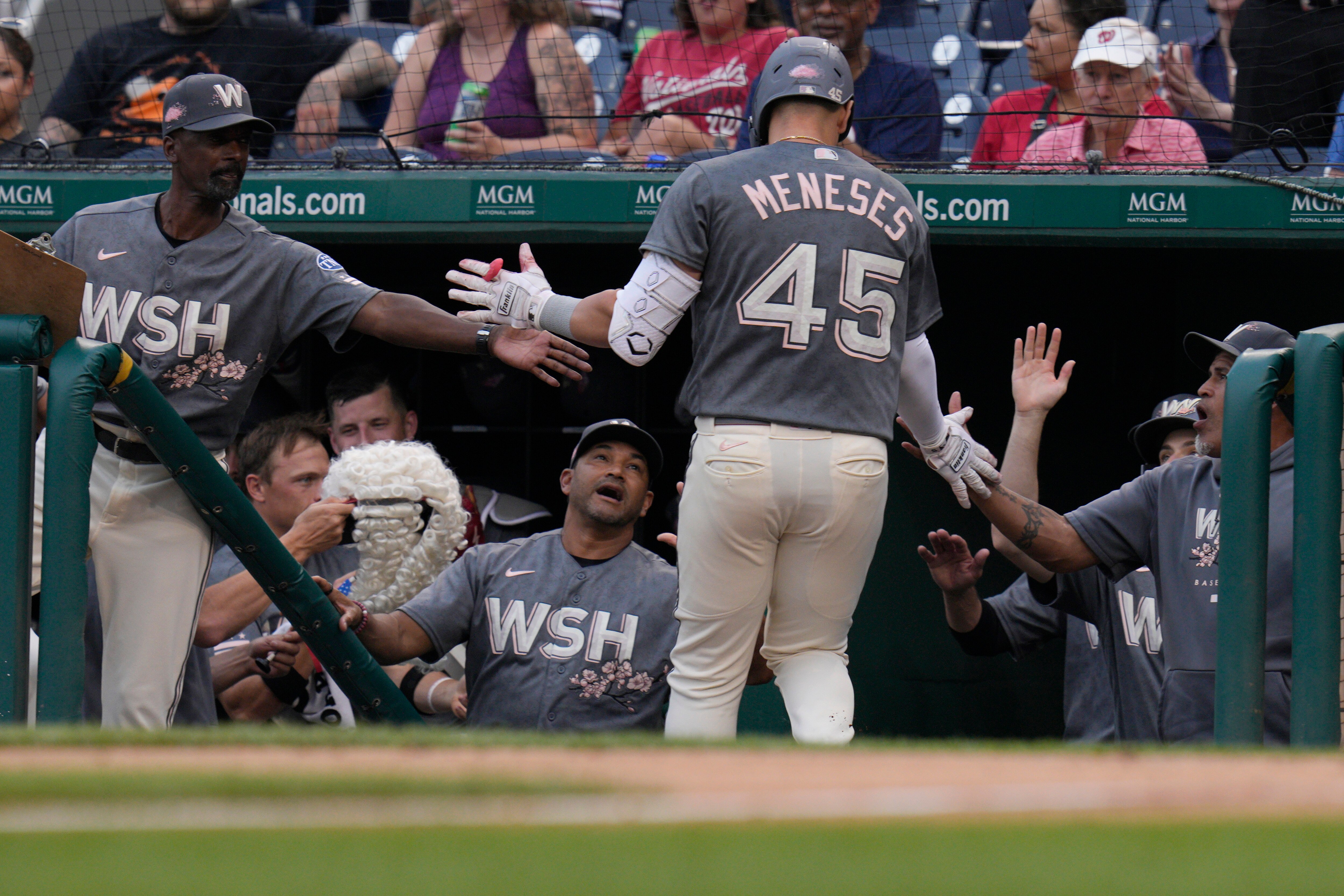 The Nationals' Joey Meneses receives congratulations after the first of his two home runs in Washington's loss to the Rangers on Friday.