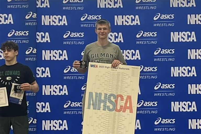 Gilman's Tyson Sherlock stands atop the podium after going 7-0 and winning the 132lbs. weight class at the NHSCA wrestling nationals in Virginia Beach, Virginia.