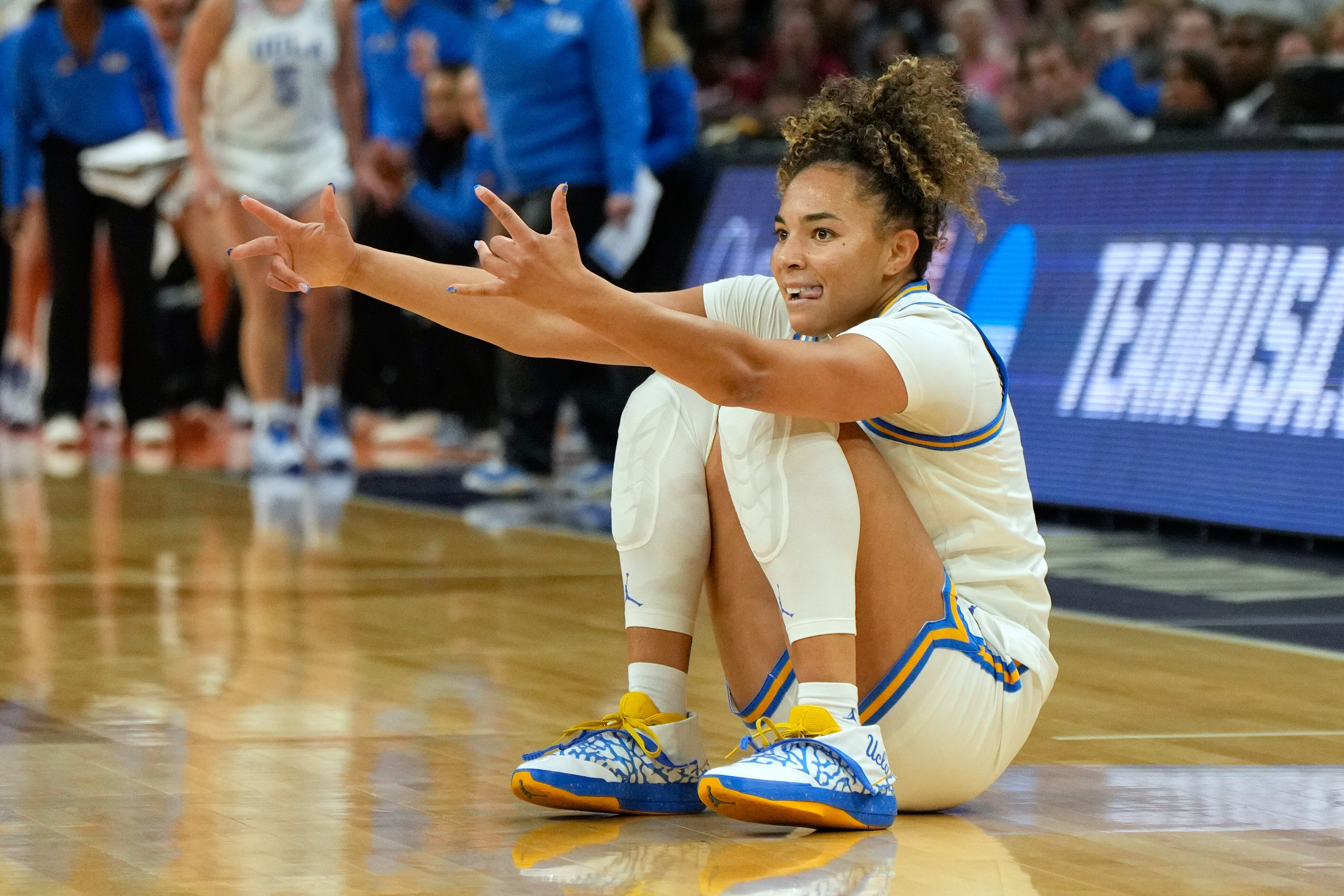 UCLA guard Kiki Rice celebrates after making a 3-point shot against South Carolina during the first half of the women's National Championship