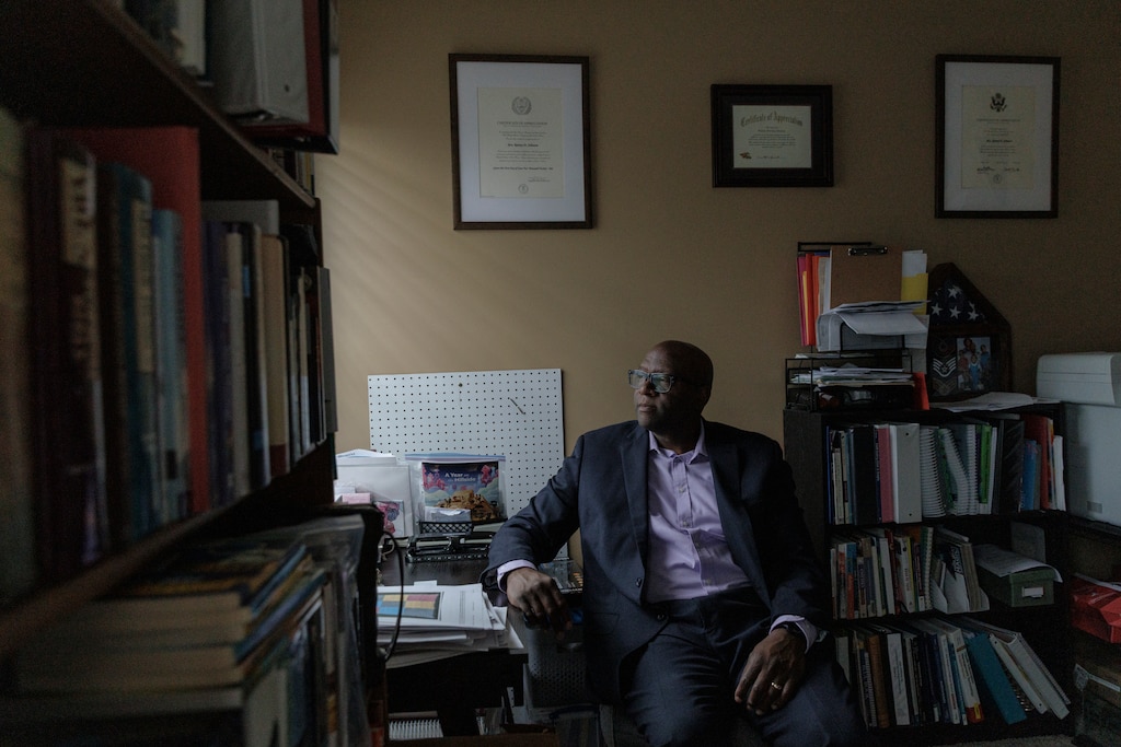 Robert Johnson III poses for a portrait in a shared office space at his home in Waldorf, Md.