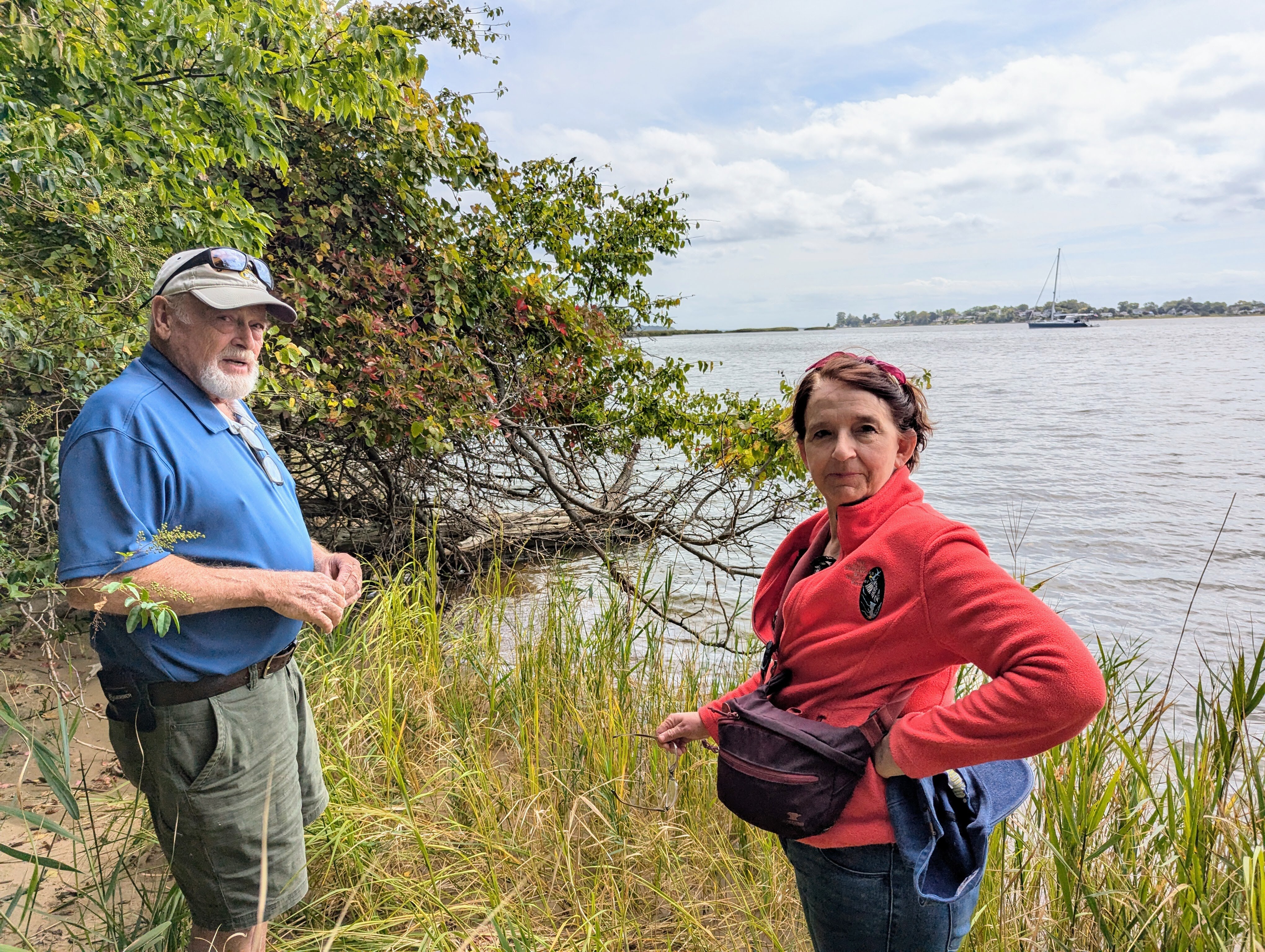 Mike Lofton and Lisa Arrasmith stand on the shore of Selby Bay at South River Farm Park on Sept. 16, 2024. The water access advocates say County Executive Steuart Pittman is taking too long to make it more available to the public.