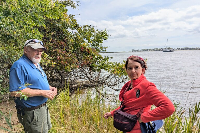 Mike Lofton and Lisa Arrasmith stand on the shore of Selby Bay at South River Farm Park on Sept. 16, 2024. The water access advocates say County Executive Steuart Pittman is taking too long to make it more available to the public.