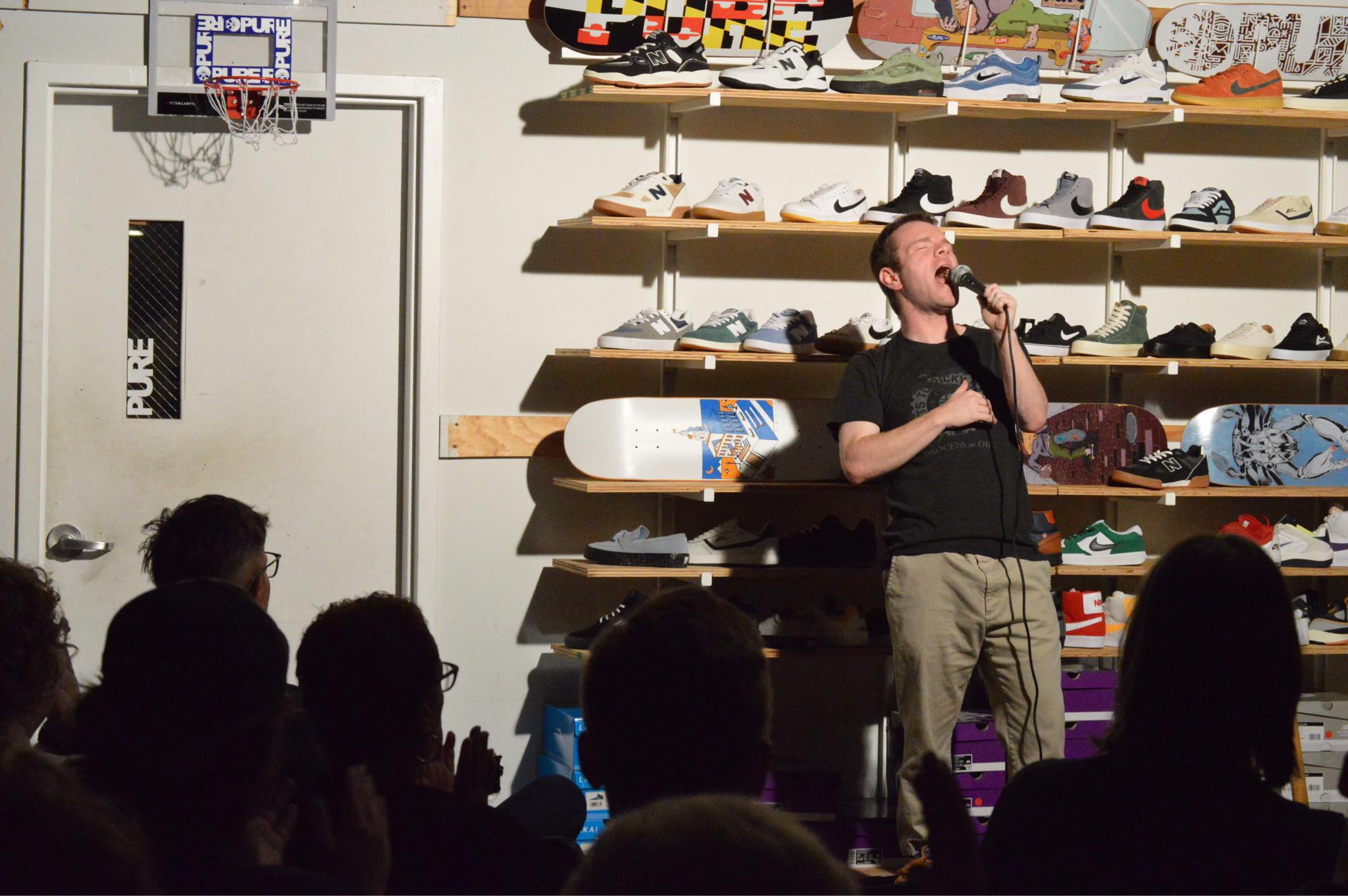 Comedian Kevin Slattery performs at Pure Board Shop in Annapolis, an unusual venue that hosts a monthly standup comedy show.