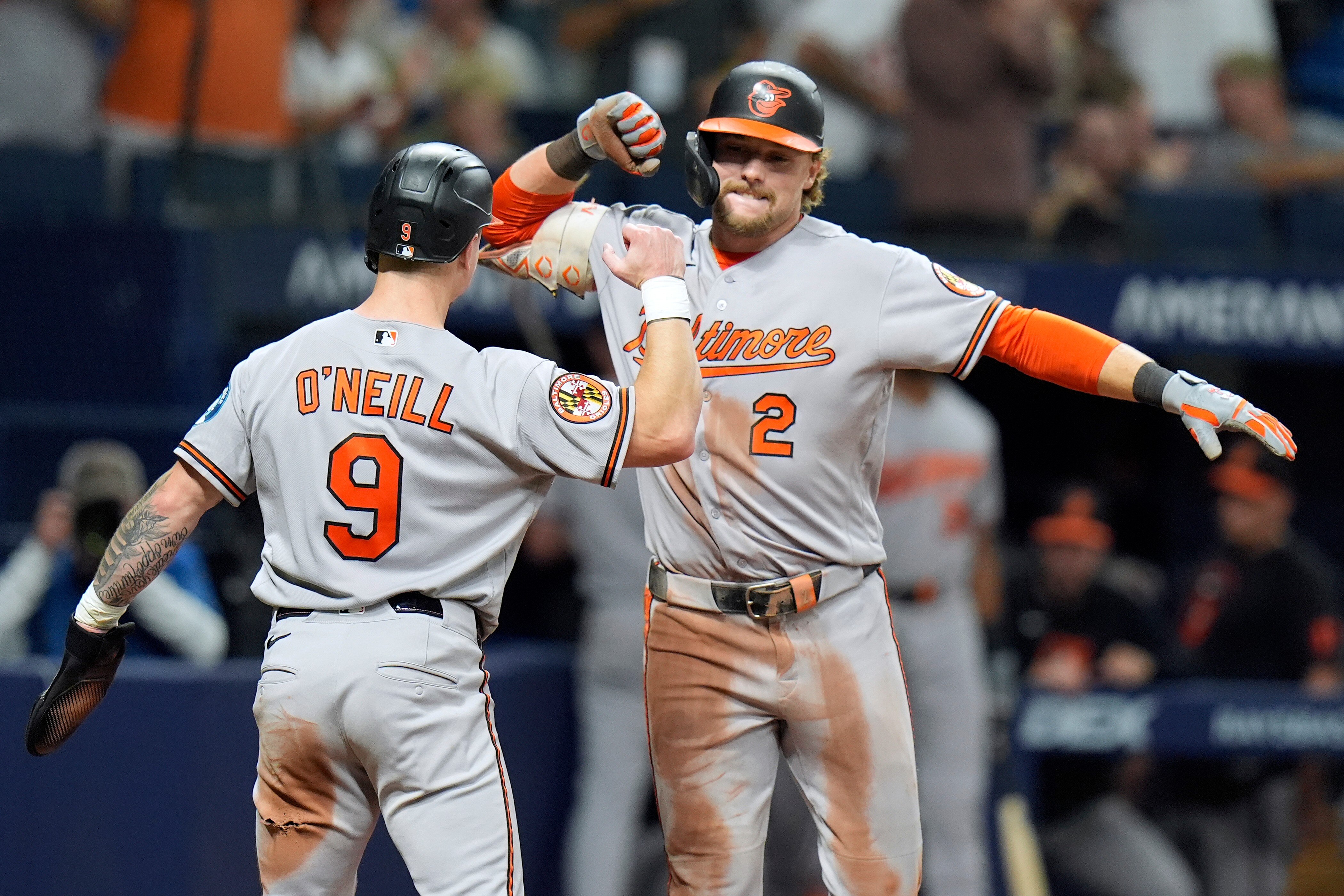 Baltimore Orioles' Gunnar Henderson (2) celebrates his two-run home run off Tampa Bay Rays pitcher Chris Roycroft with Tyler O'Neill (9) during the eighth inning of a baseball game Friday, Aug. 14, 2026, in St. Petersburg, Fla. (AP Photo/Chris O'Meara)