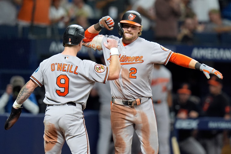 Baltimore Orioles' Gunnar Henderson (2) celebrates his two-run home run off Tampa Bay Rays pitcher Chris Roycroft with Tyler O'Neill (9) during the eighth inning of a baseball game Friday, Aug. 14, 2026, in St. Petersburg, Fla. (AP Photo/Chris O'Meara)