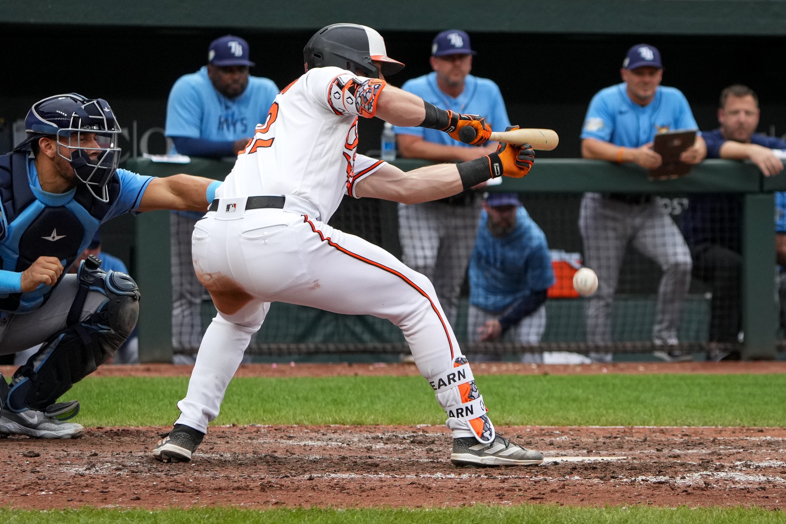 Baltimore Orioles first baseman Ryan O’Hearn (32) hits a sacrifice bunt to advance catcher Adley Rutschman to third base in the 11th inning of a game against the Tampa Bay Rays on Sunday, Sept. 17, 2023.