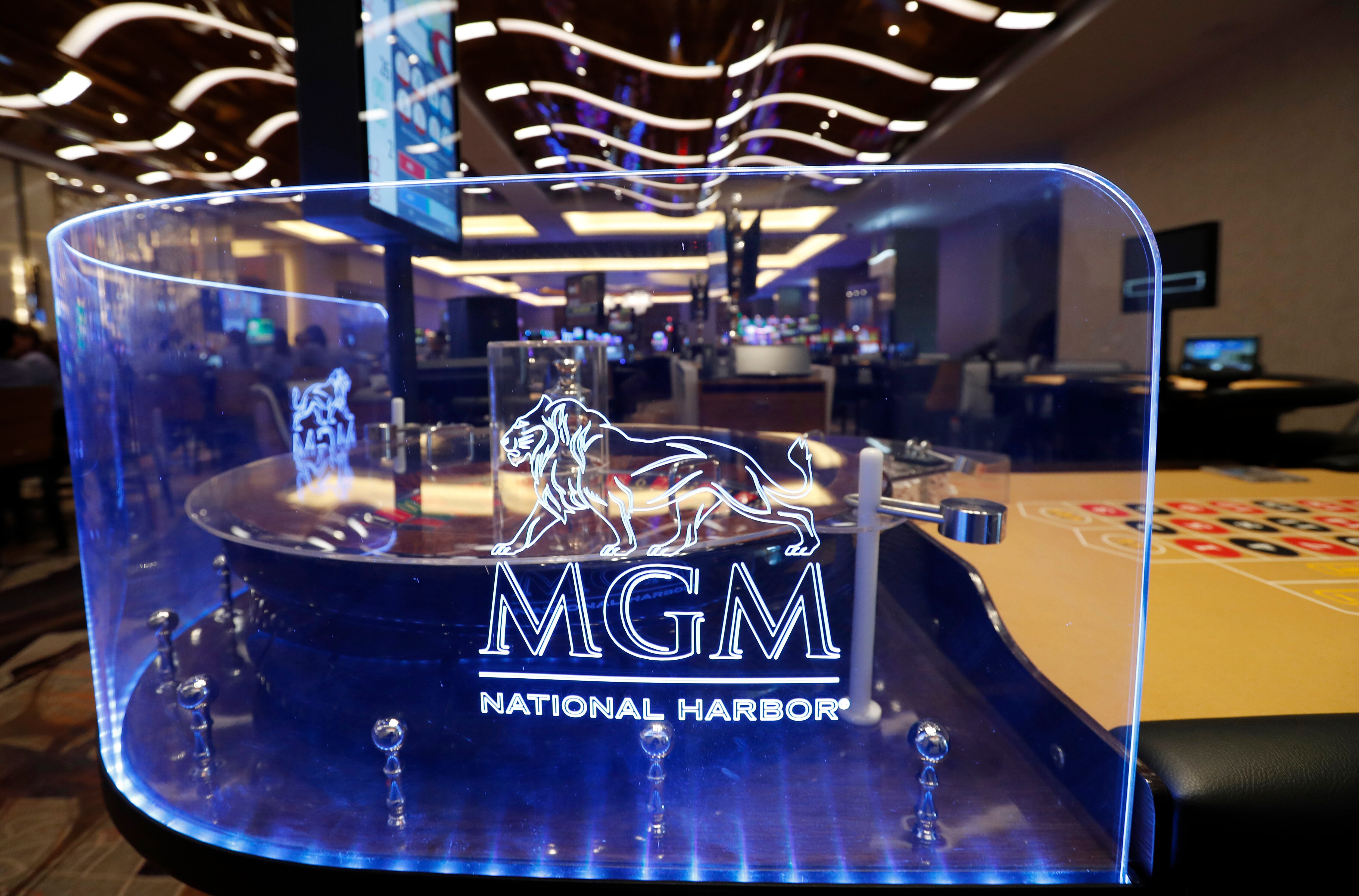 FILE - The MGM National Harbor logo is seen around a roulette wheel in the casino during a preview tour of the MGM National Harbor, Dec. 2, 2016 in Oxon Hill, Md.  (AP Photo/Alex Brandon, File)