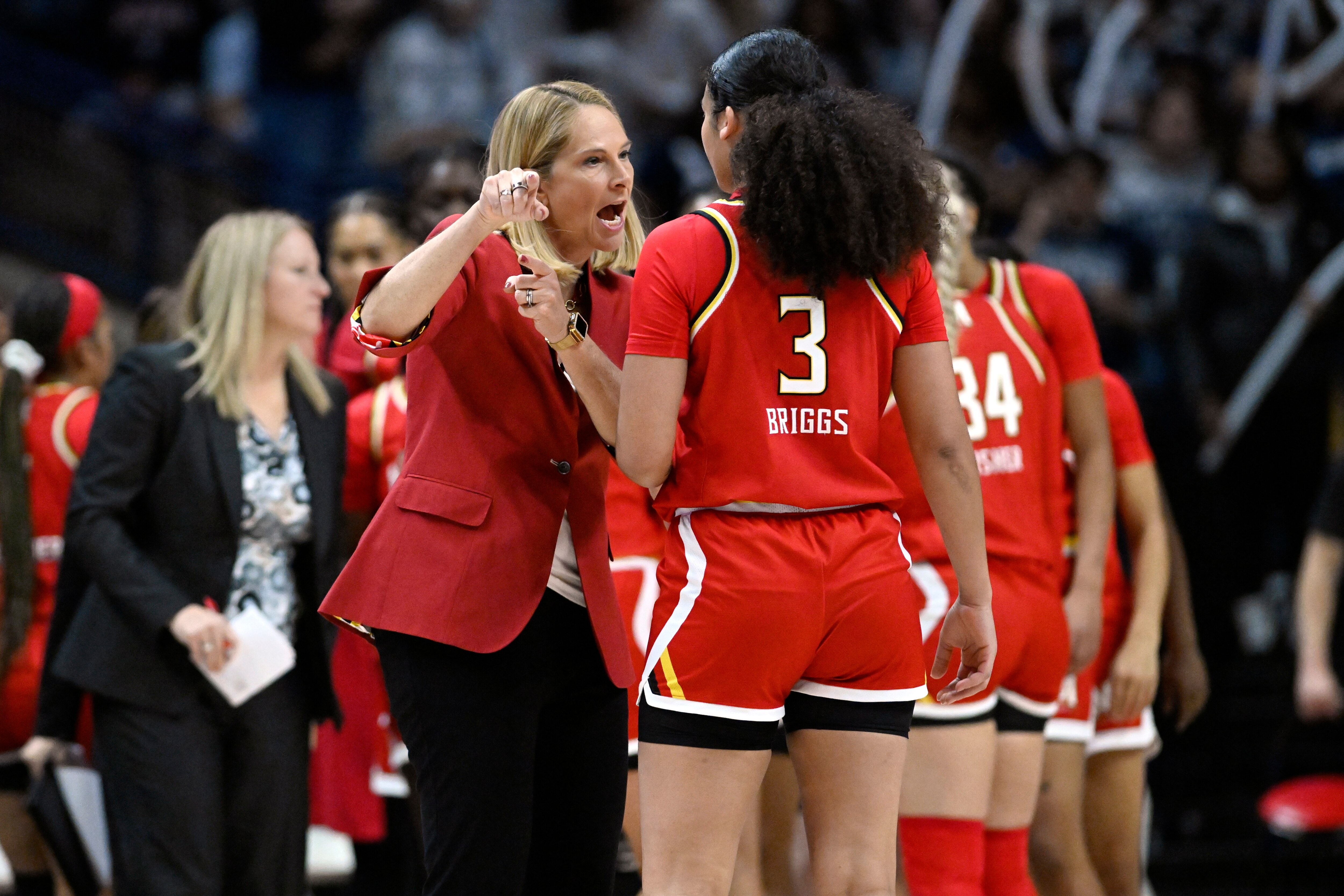 Maryland coach Brenda Frese talks with guard Lavender Briggs (3) during the second half of the team’s NCAA college basketball game against UConn, Thursday, Nov. 16, 2023, in Storrs, Connecticut.
